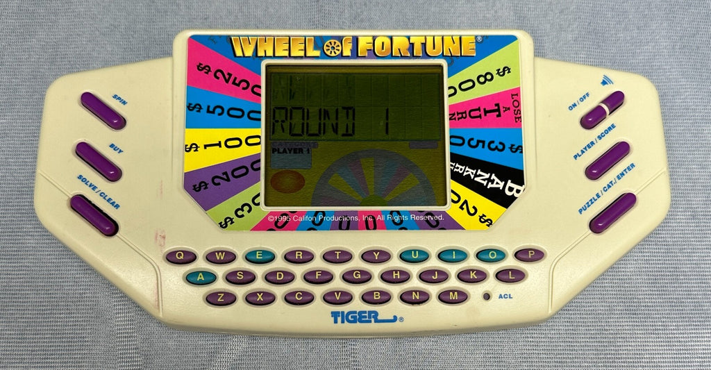 1995 Vintage Wheel of Fortune Handheld Game Tiger Electronics /w Cartridge WORKS