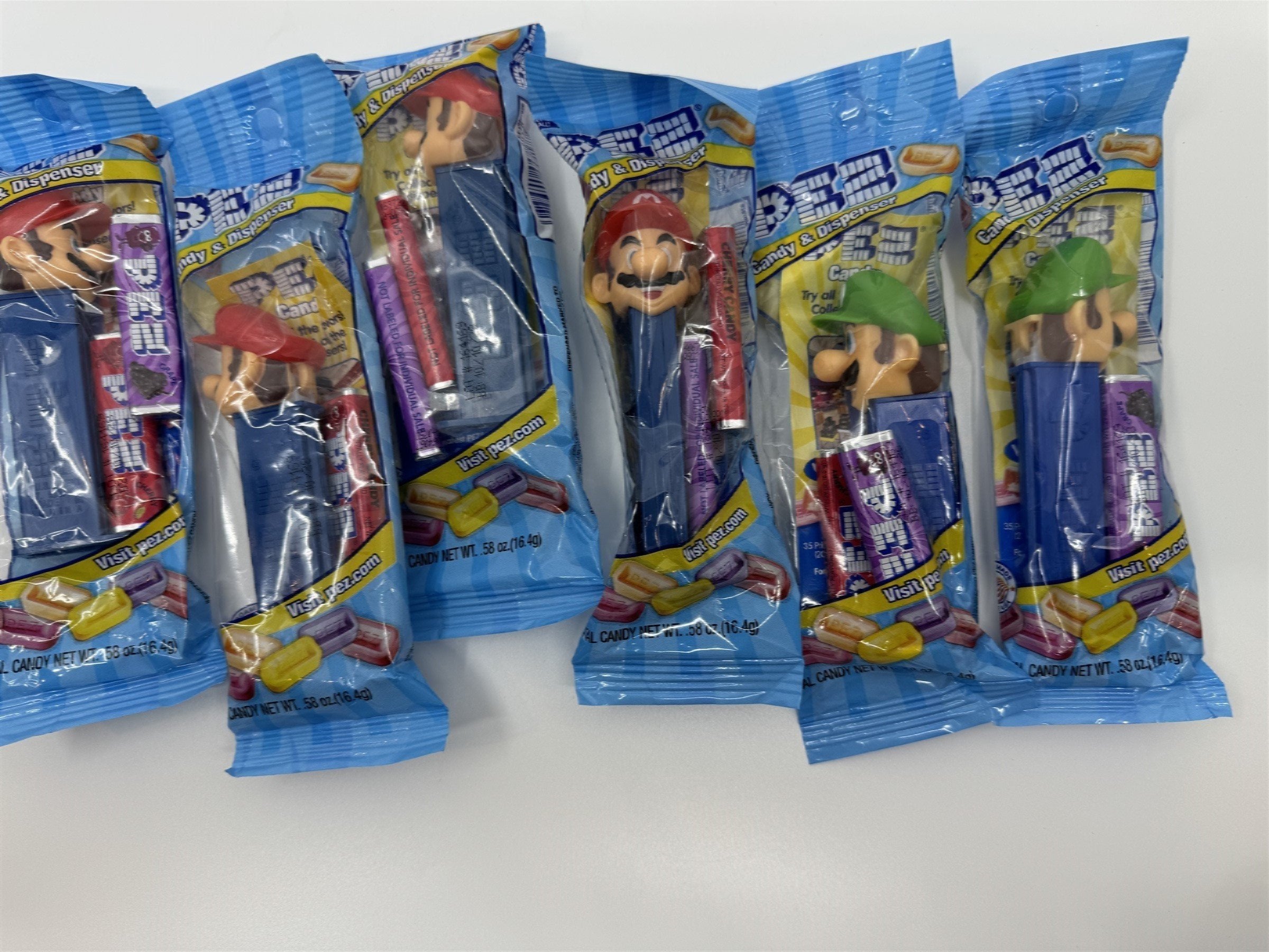 Lot of 6 Super Smash Brothers Pez Dispensers - 4x Mario & 2x Luigi NEW Exp 10/28
