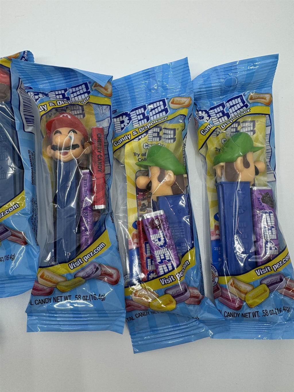 Lot of 6 Super Smash Brothers Pez Dispensers - 4x Mario & 2x Luigi NEW Exp 10/28