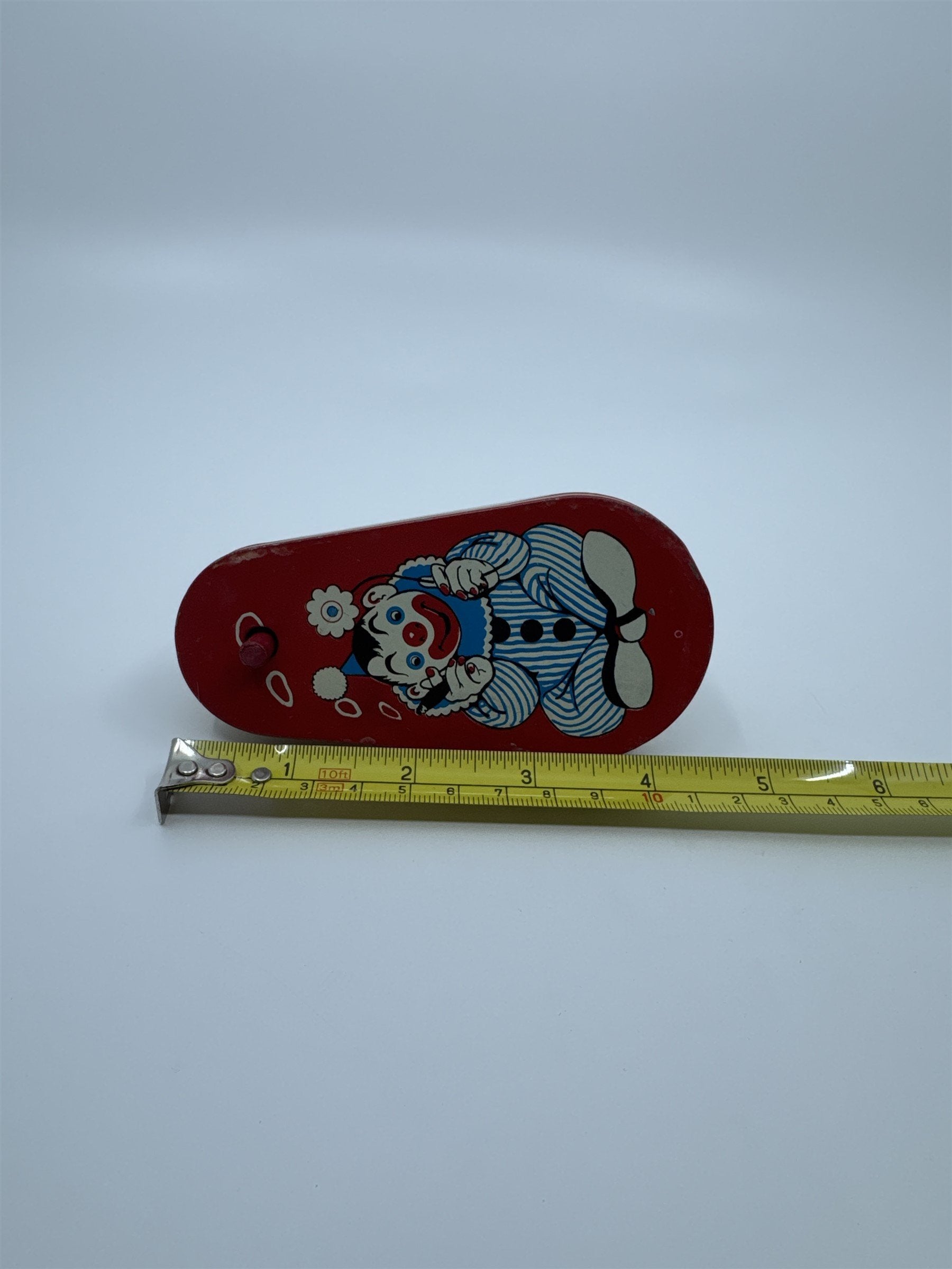 Vintage 1950s Tin Litho Winding Noisemaker USA Cigar Rings Smoking Clown Flower