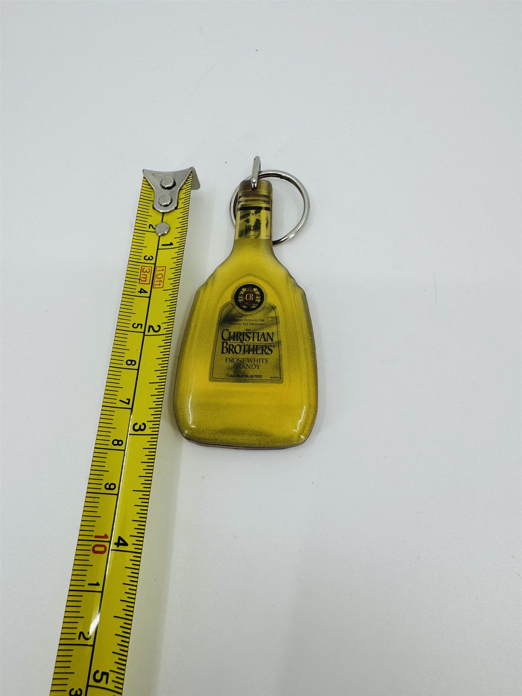 Vintage Christian Brothers Frost White Brandy Promotional Enamel Keychain