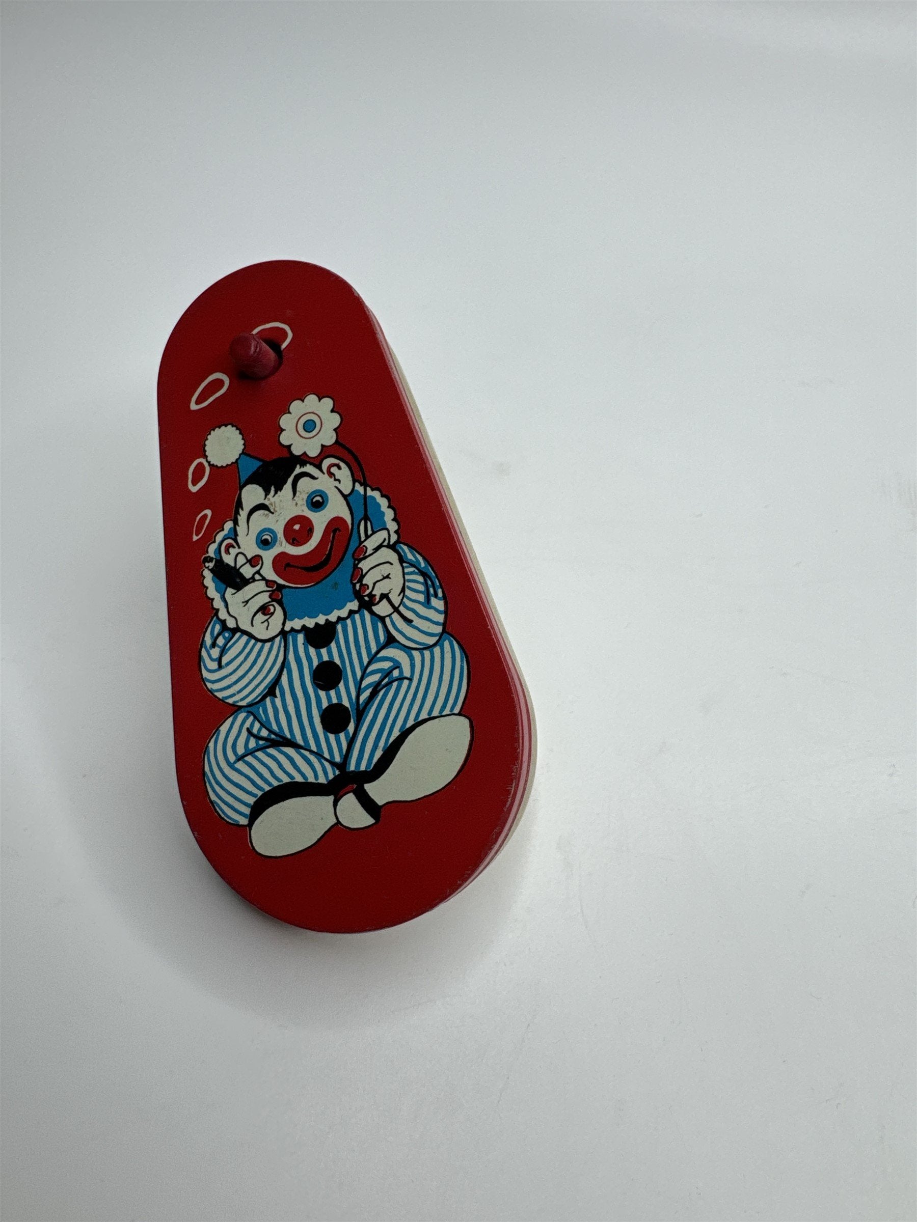 Vintage 1950s Tin Litho Winding Noisemaker USA Cigar Smoke Rings Clown Flower