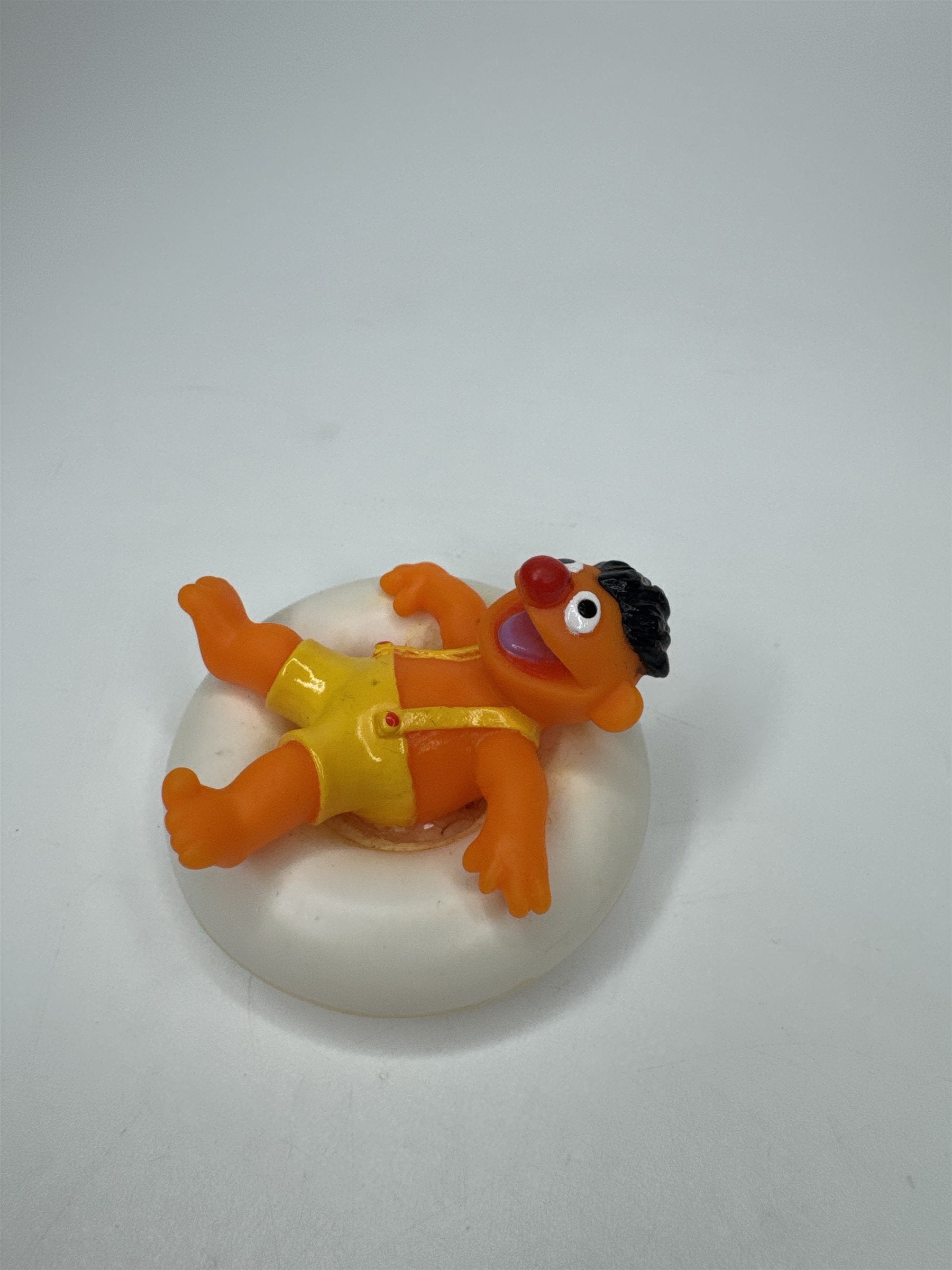 Sesame Street ERNIE PVC Figure on Plastic Inner Tube Float 2.5" Marks/Cracked
