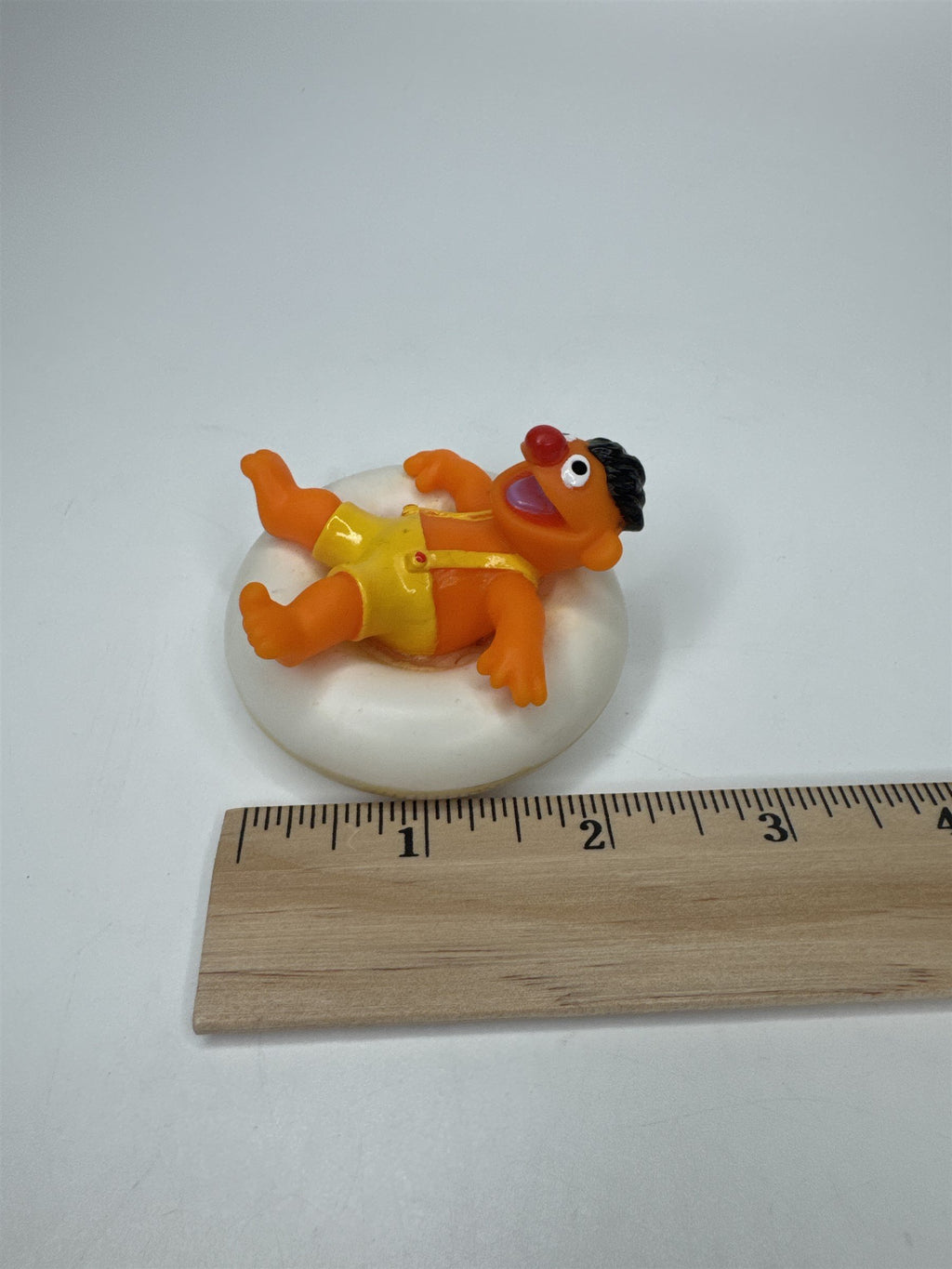 Sesame Street ERNIE PVC Figure on Plastic Inner Tube Float 2.5" Marks/Cracked