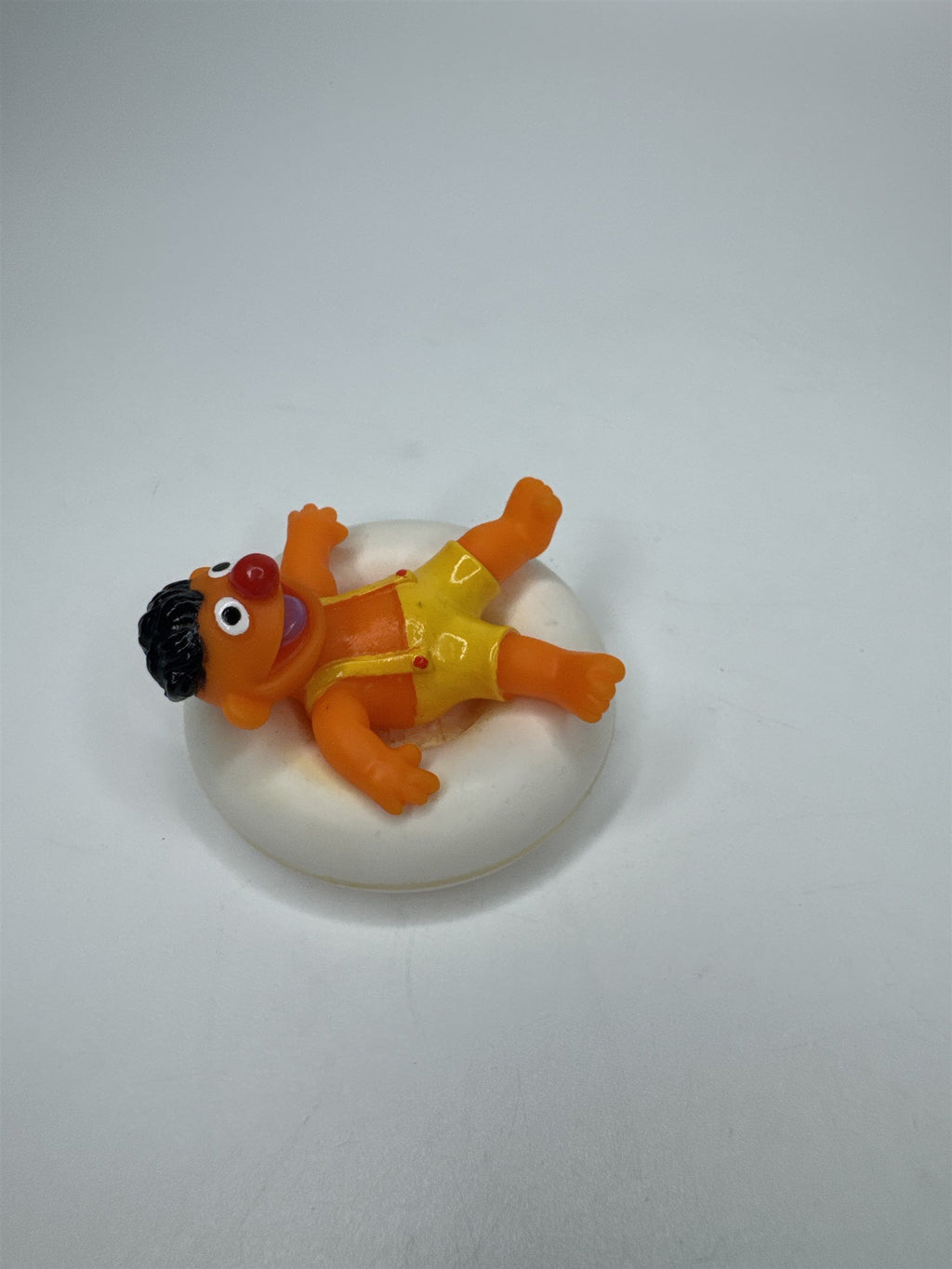 Sesame Street ERNIE PVC Figure on Plastic Inner Tube Float 2.5" Marks/Cracked