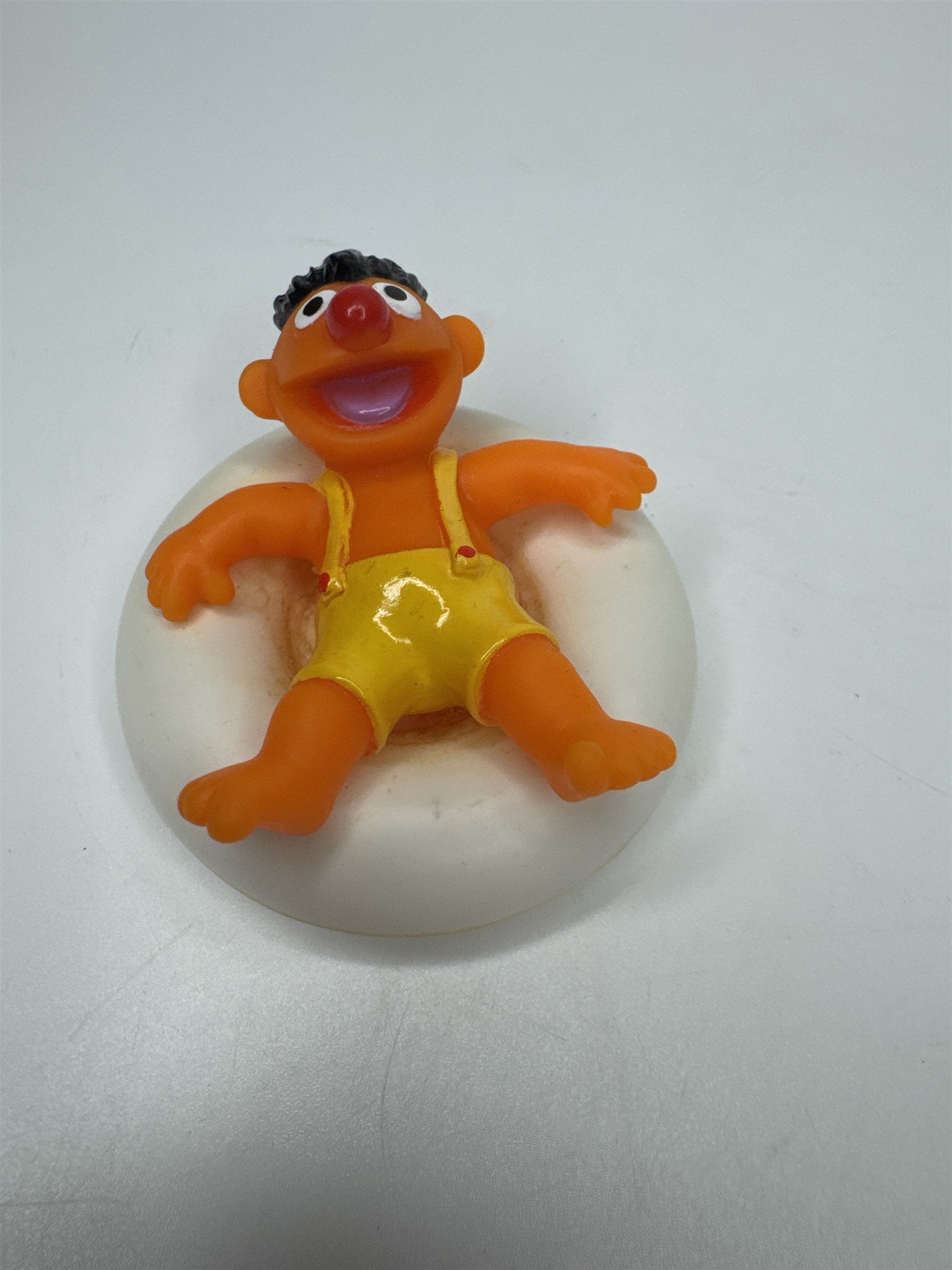 Sesame Street ERNIE PVC Figure on Plastic Inner Tube Float 2.5" Marks/Cracked