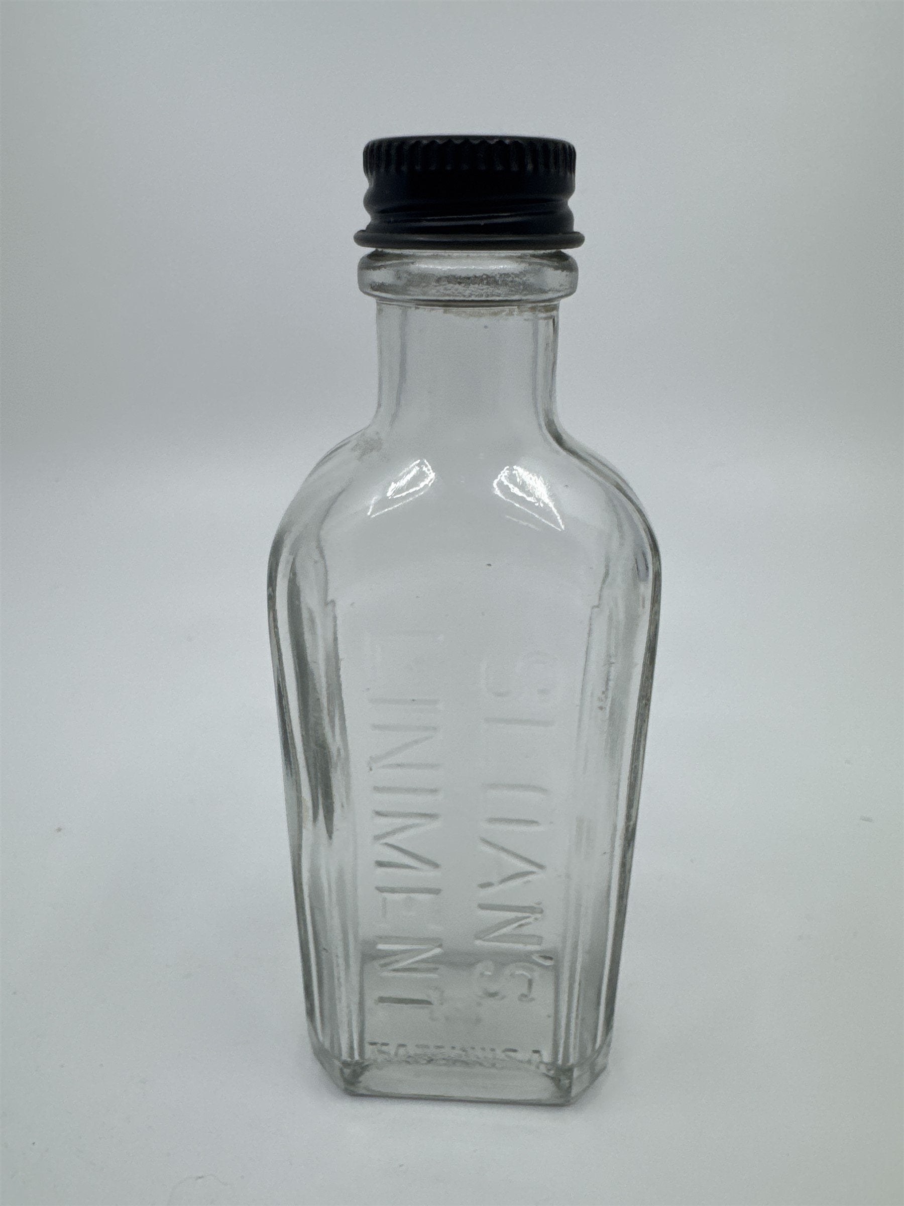Vintage Sloan's Liniment Embossed Glass Bottle with Black Twist Cap