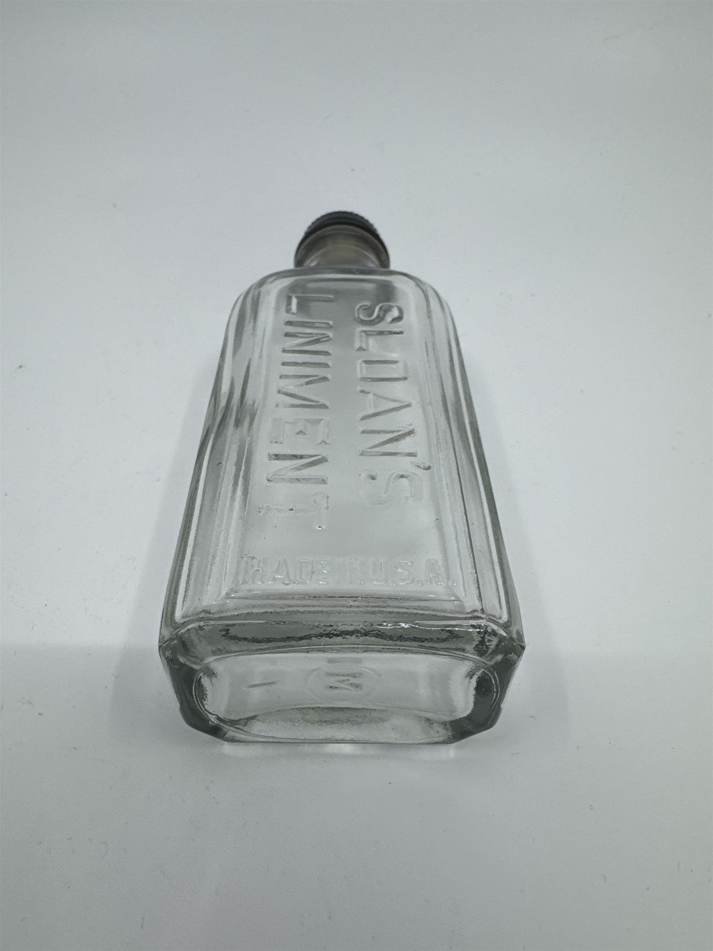 Vintage Sloan's Liniment Embossed Glass Bottle with Black Twist Cap