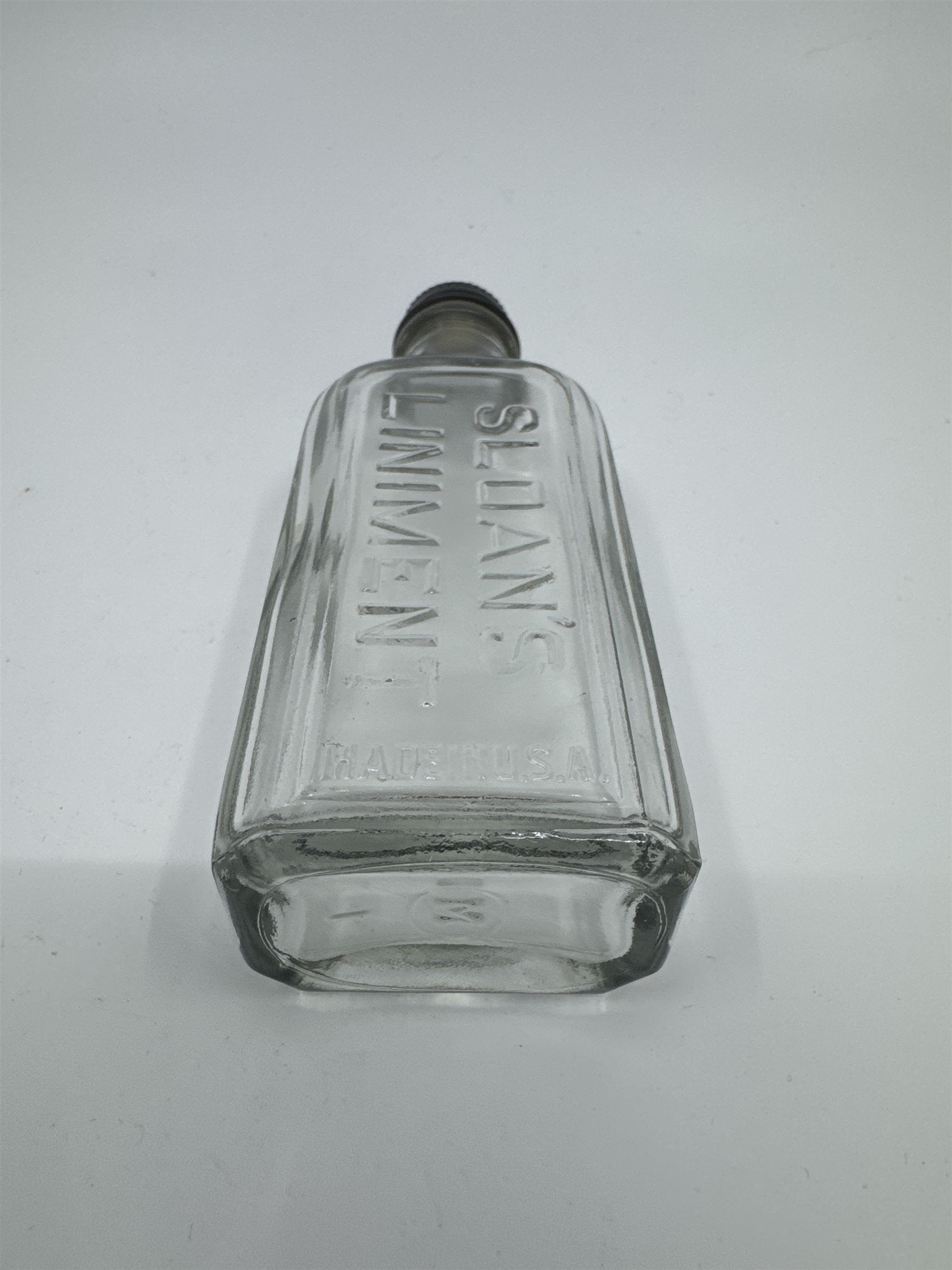 Vintage Sloan's Liniment Embossed Glass Bottle with Black Twist Cap