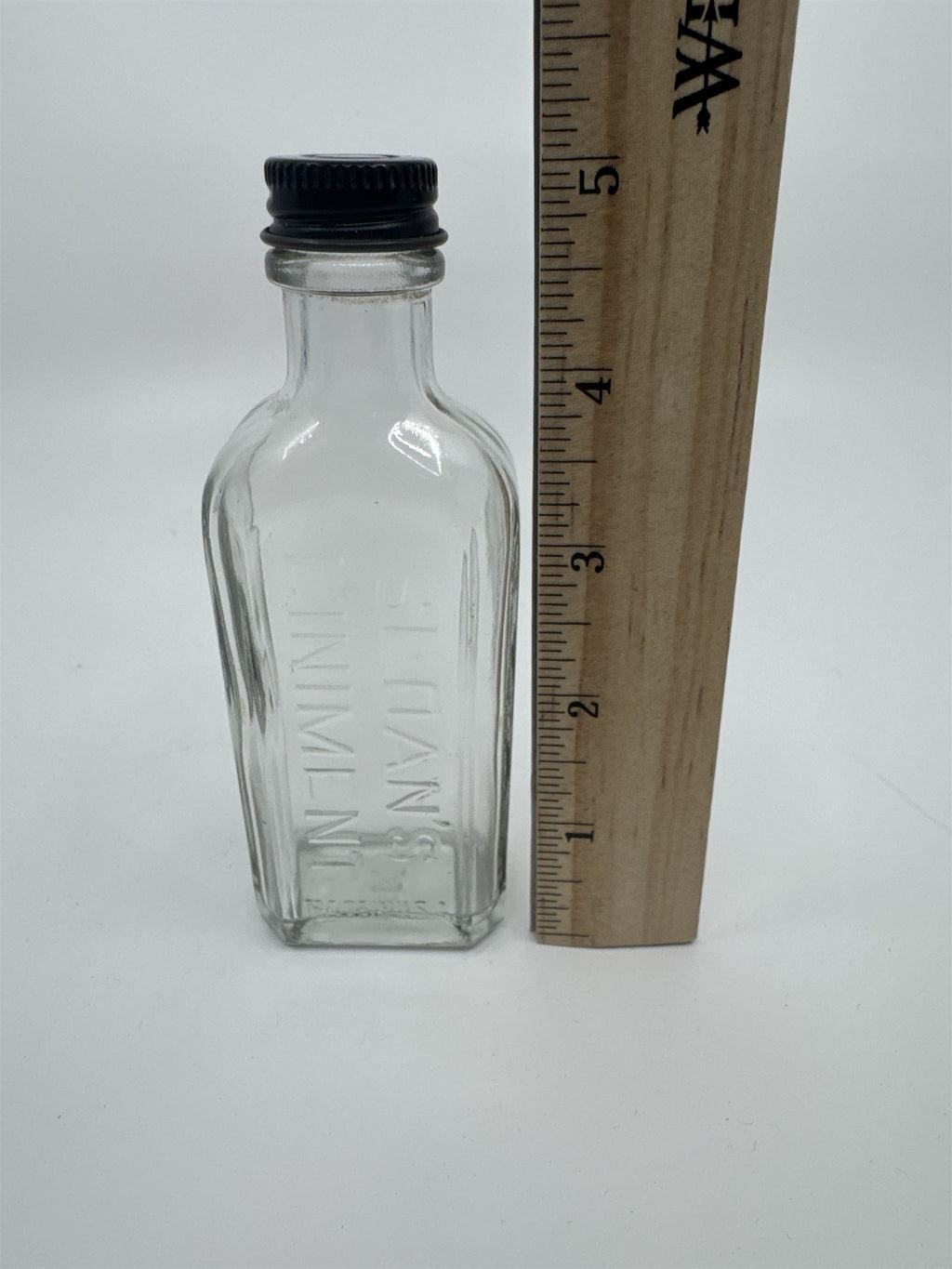 Vintage Sloan's Liniment Embossed Glass Bottle with Black Twist Cap