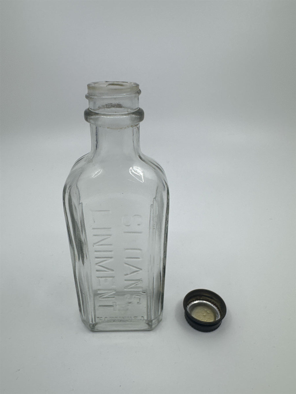 Vintage Sloan's Liniment Embossed Glass Bottle with Black Twist Cap