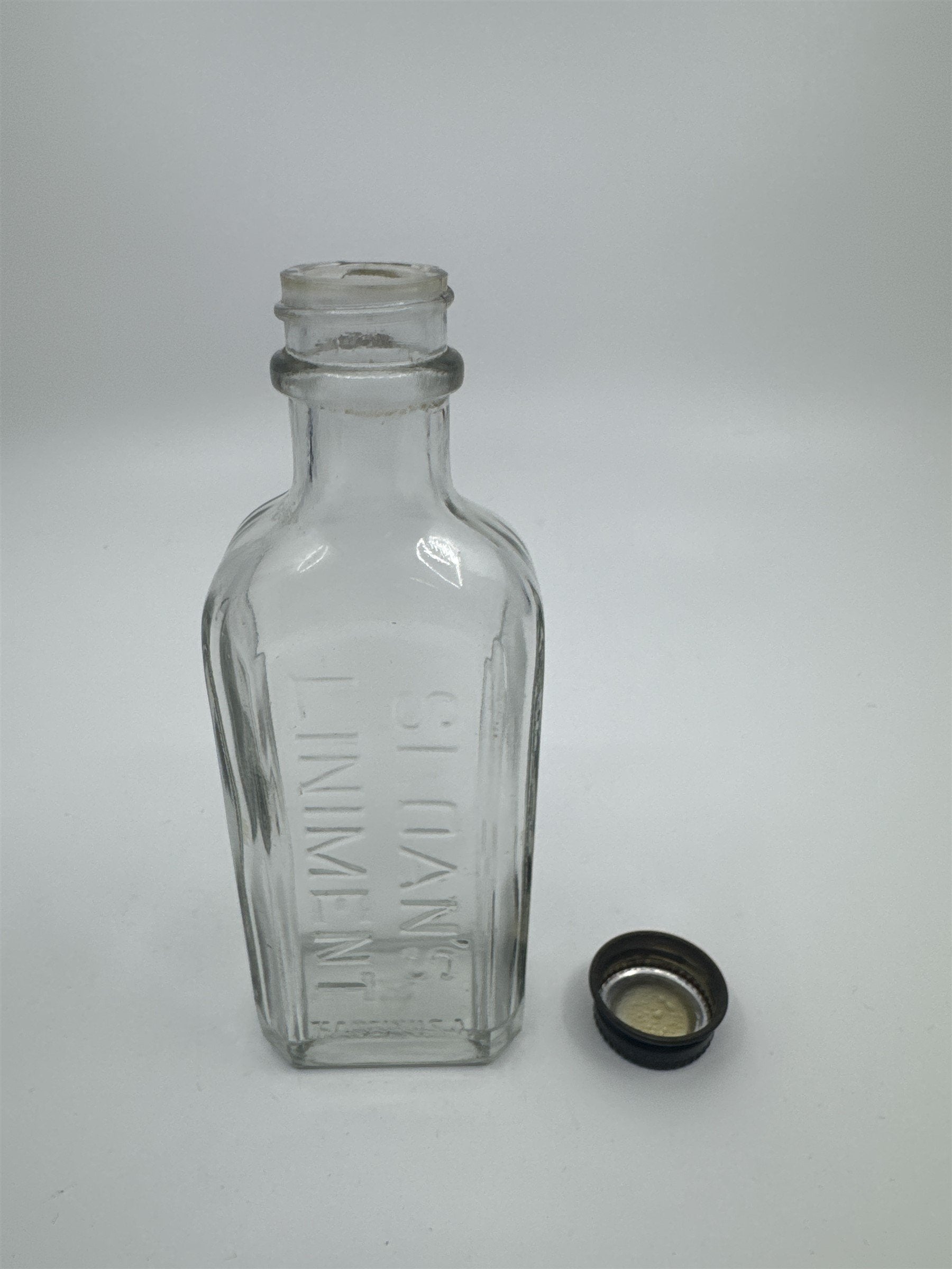 Vintage Sloan's Liniment Embossed Glass Bottle with Black Twist Cap