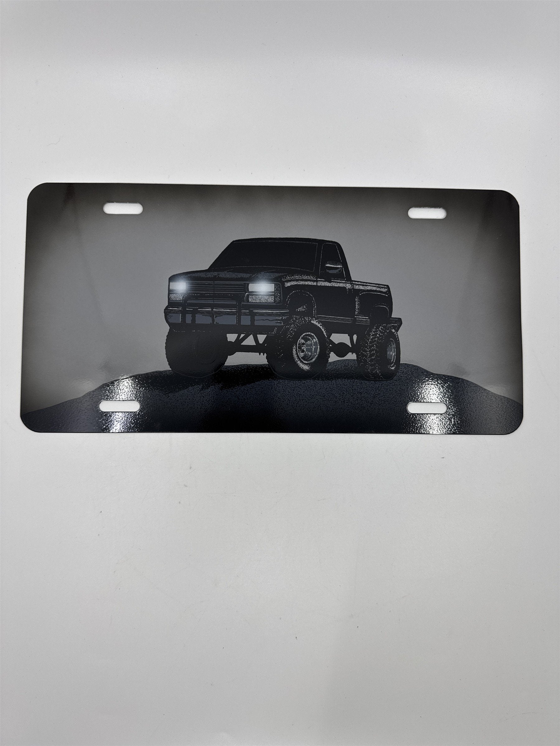 Vintage Grey Metal License Plate Sign with Black Lifted Truck for Truck Lovers