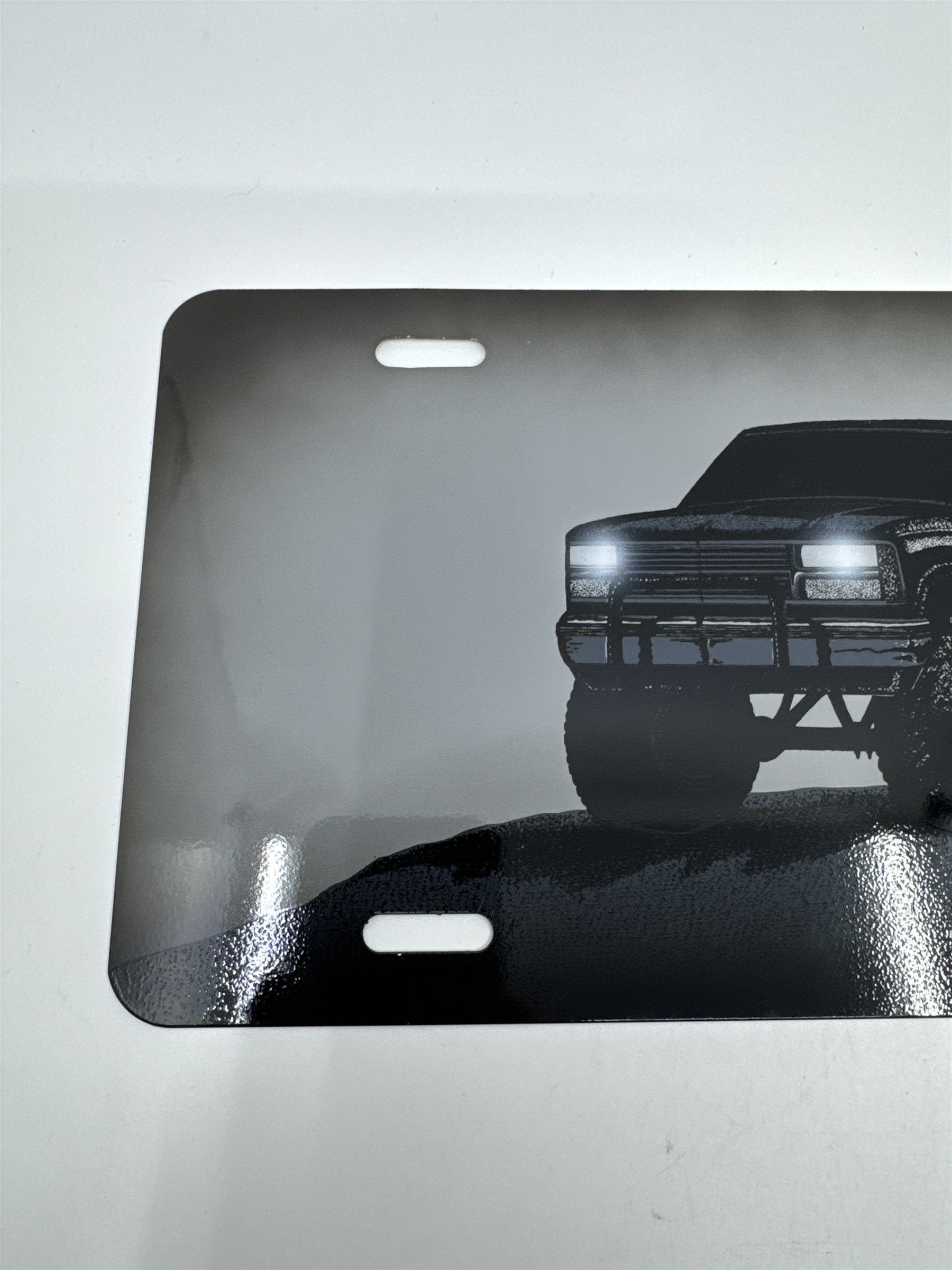 Vintage Grey Metal License Plate Sign with Black Lifted Truck for Truck Lovers