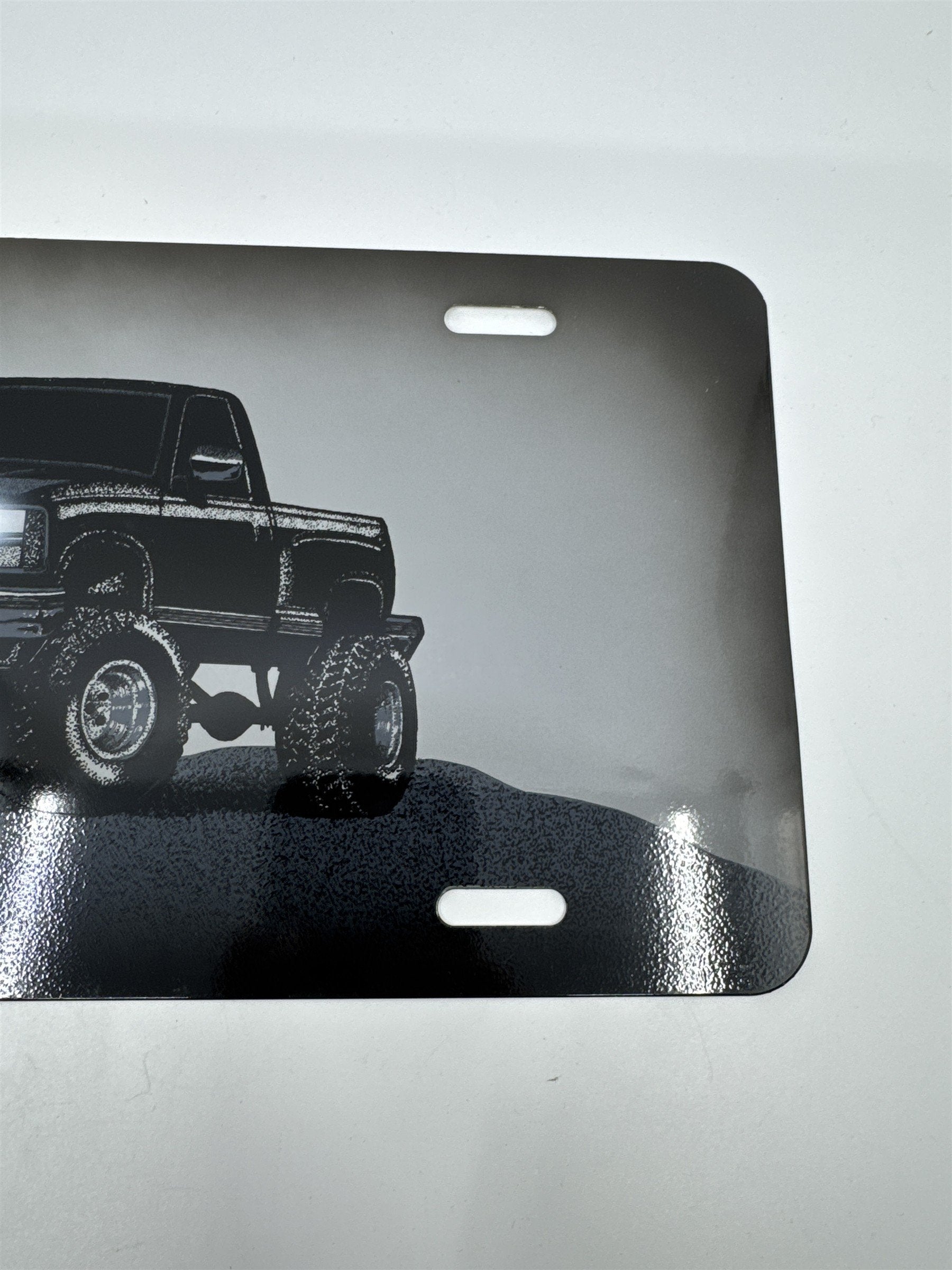 Vintage Grey Metal License Plate Sign with Black Lifted Truck for Truck Lovers