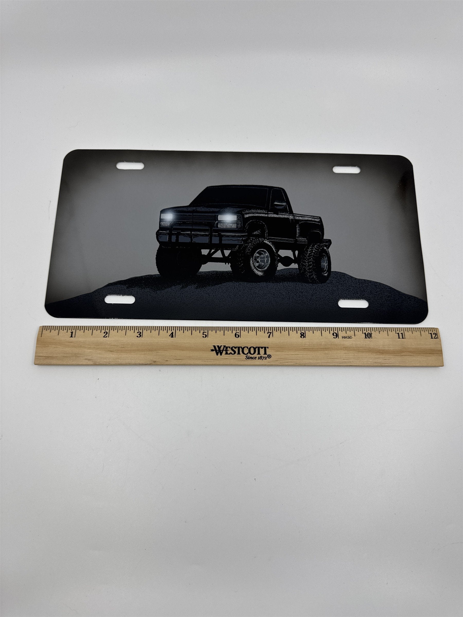 Vintage Grey Metal License Plate Sign with Black Lifted Truck for Truck Lovers