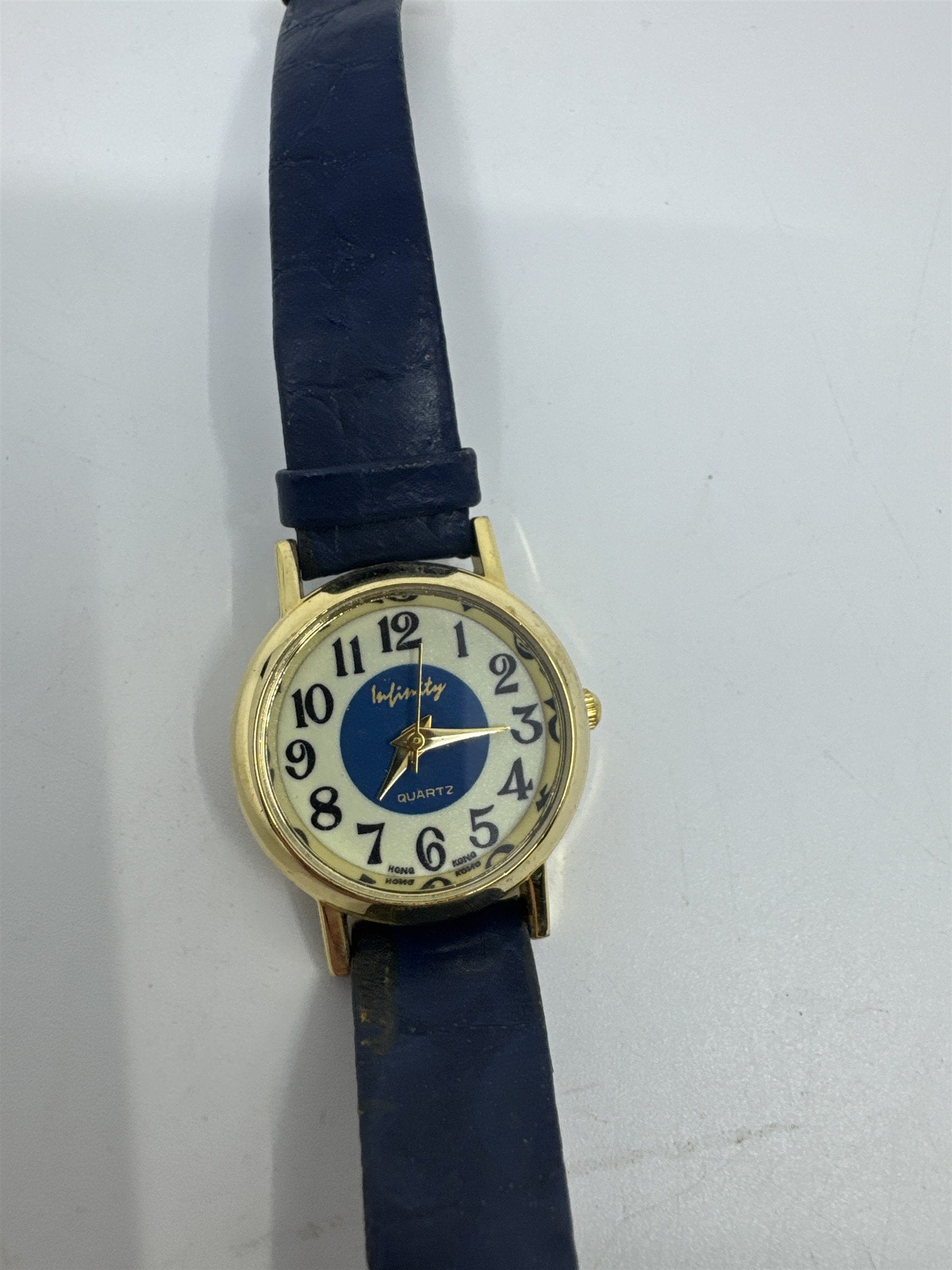 Vintage Blue Infinity Hong Kong Quartz Womens Wristwatch Gold Tone Leather Band