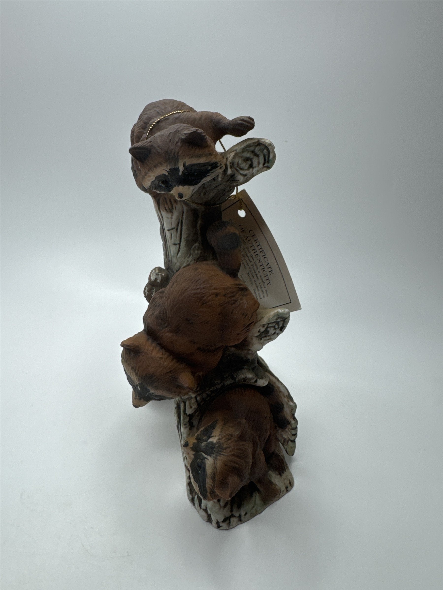 Vintage Masterpiece by Homco Home Interiors Ceramic Racoon Family on Log Tree