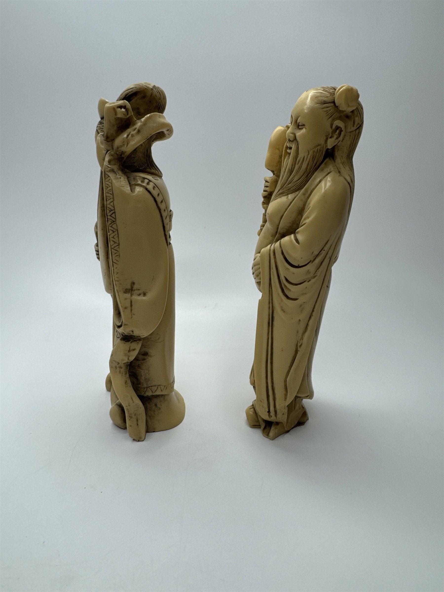 Vintage Resin Asian Statues of Woman Playing Instrument and Man Patting Belly