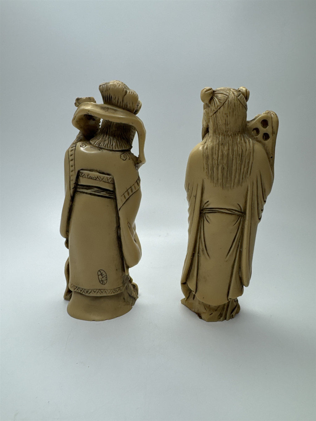 Vintage Resin Asian Statues of Woman Playing Instrument and Man Patting Belly