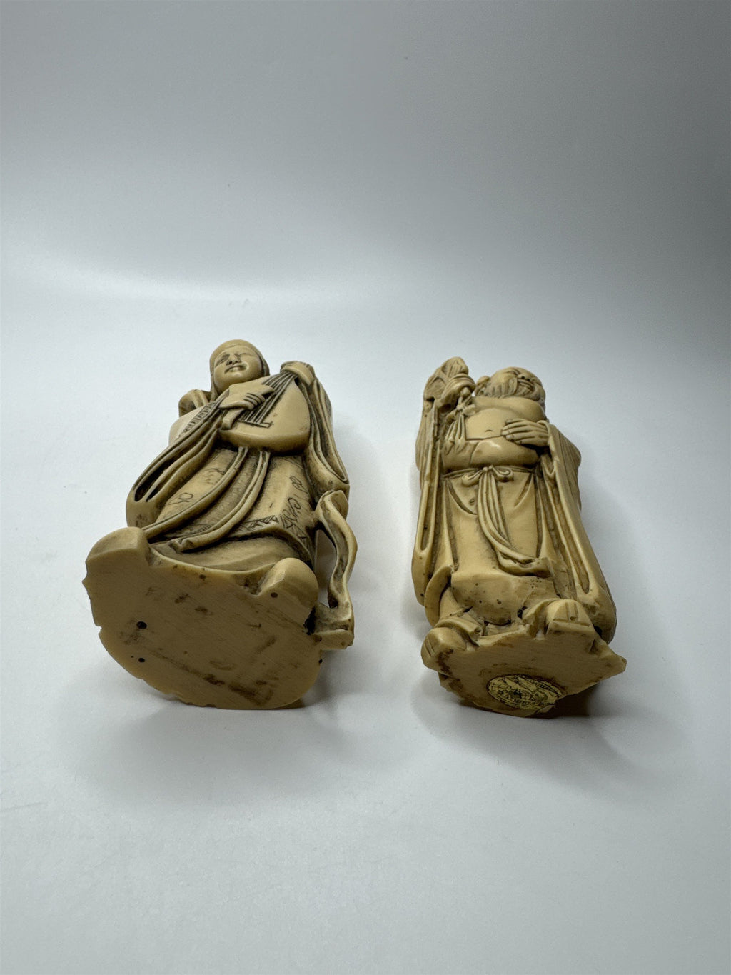 Vintage Resin Asian Statues of Woman Playing Instrument and Man Patting Belly