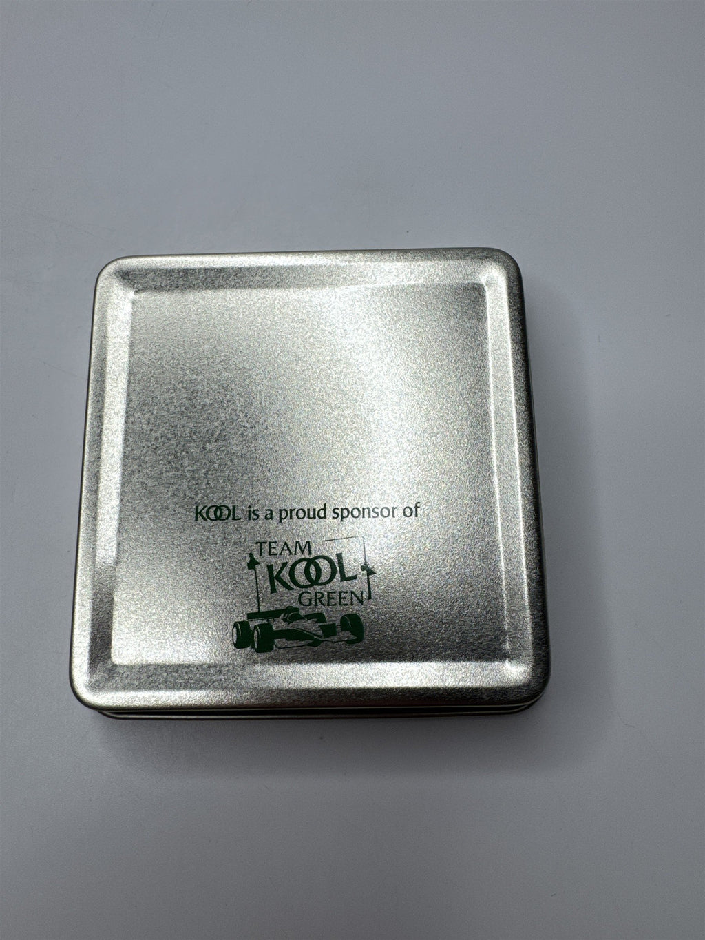 Vintage Kool Team Green Metal Swing Top Racecar Empty Cigarette Tin Container