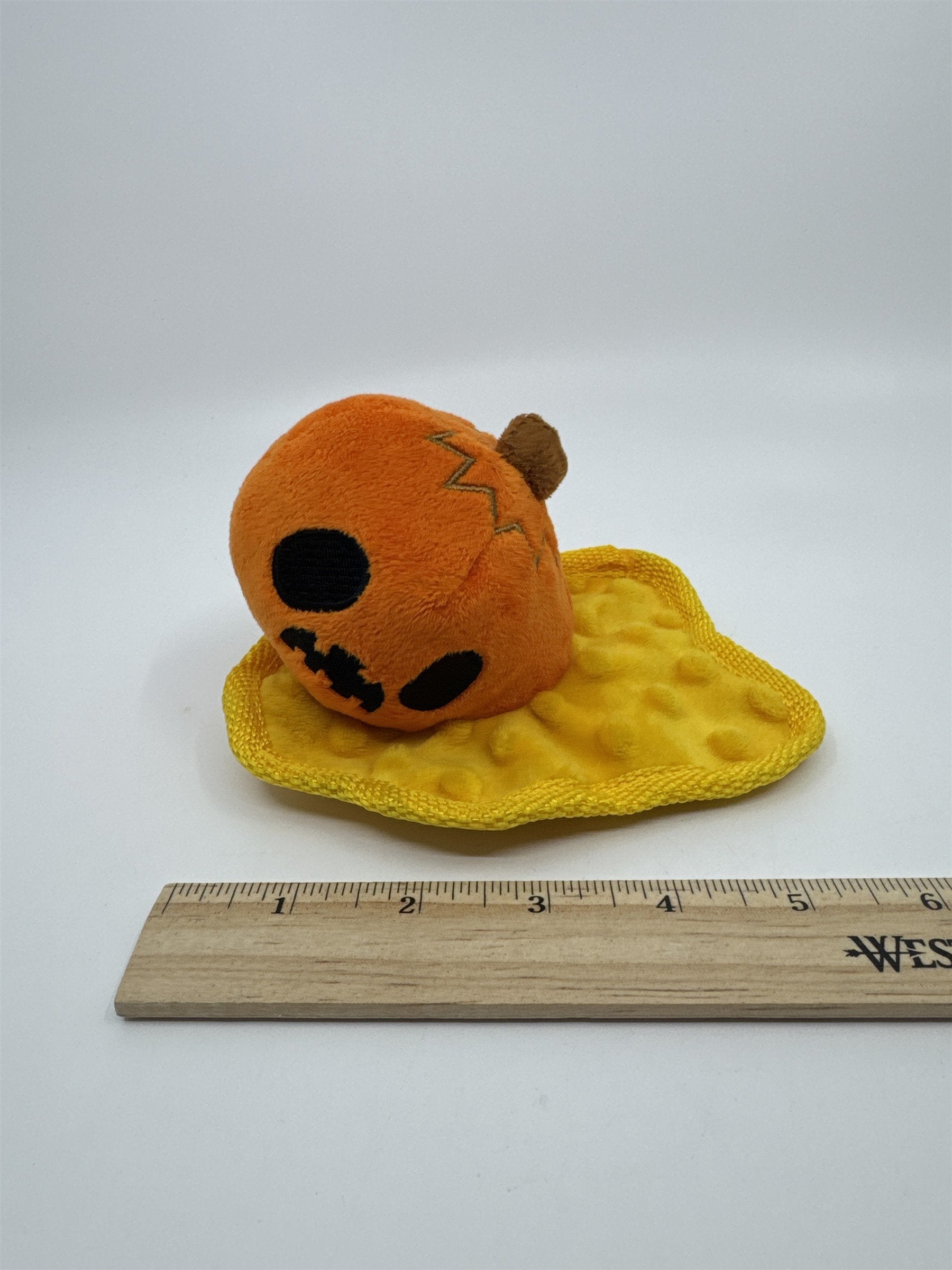 Smashed Pumpkin Halloween Bark Squeaker Dog Toy