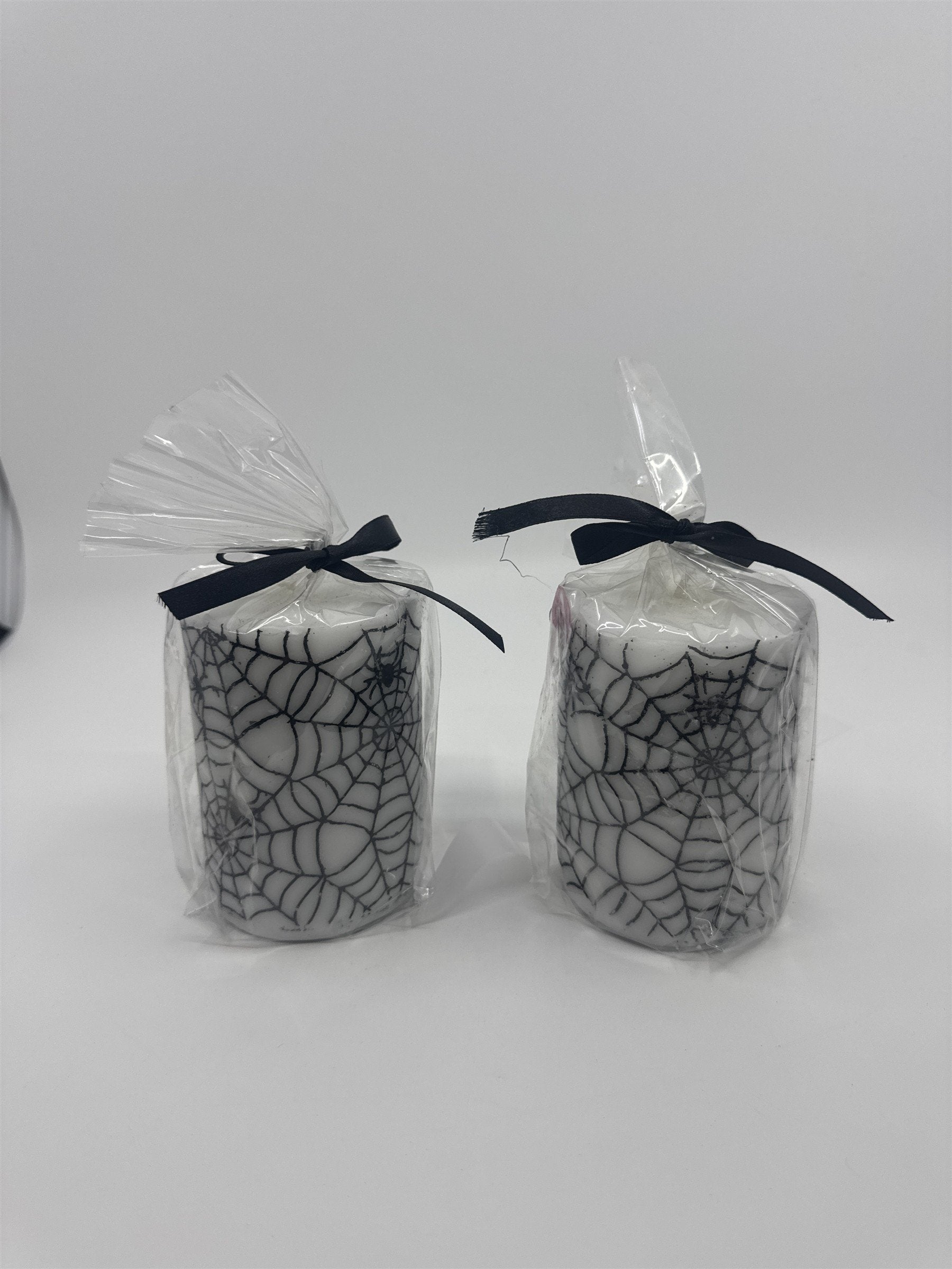 Set of Two White And Black Halloween Spider Web Candles In Plastic