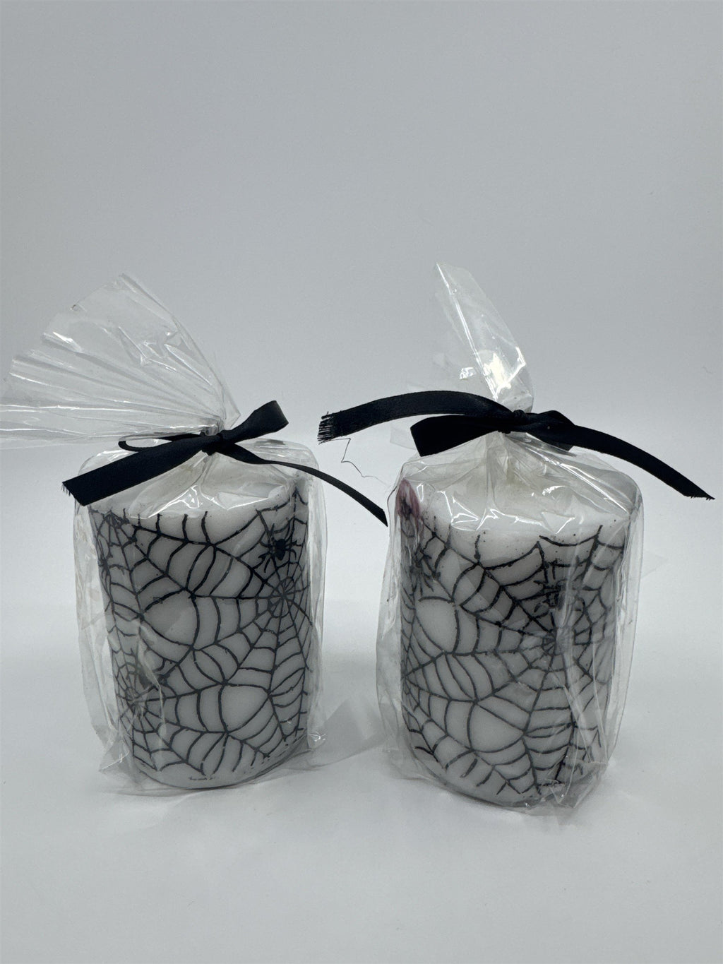 Set of Two White And Black Halloween Spider Web Candles In Plastic