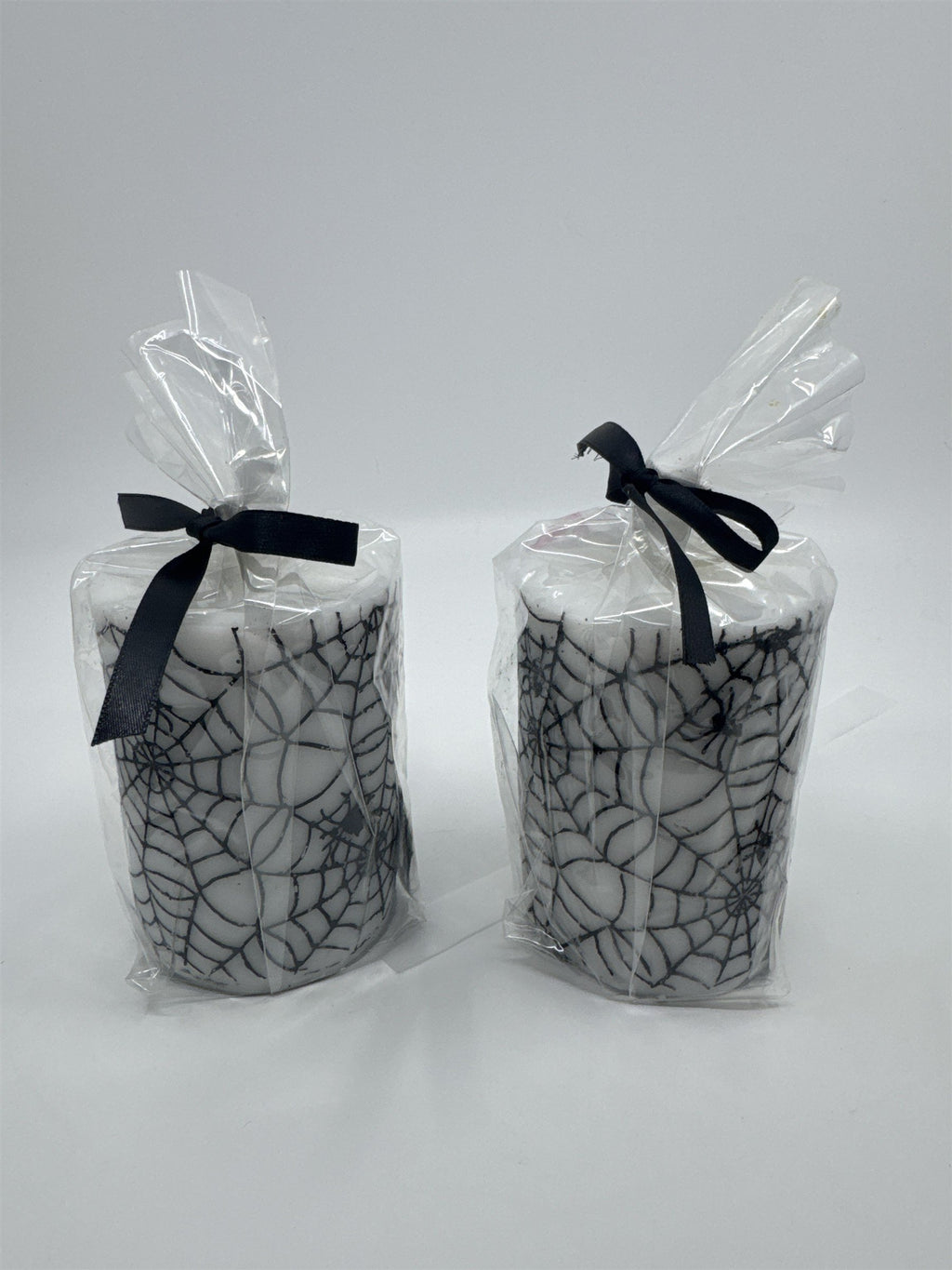 Set of Two White And Black Halloween Spider Web Candles In Plastic