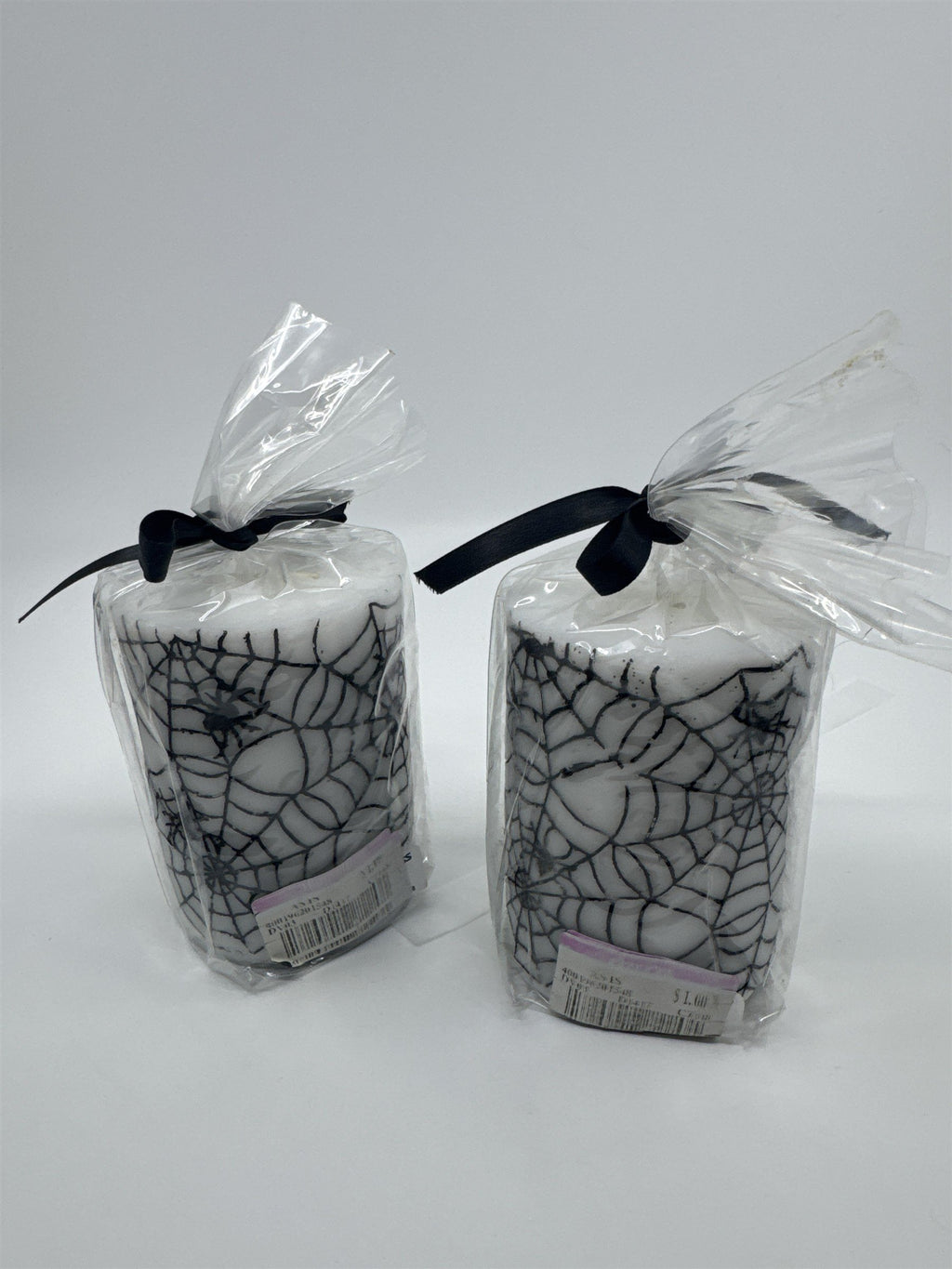 Set of Two White And Black Halloween Spider Web Candles In Plastic