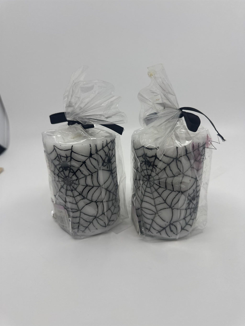 Set of Two White And Black Halloween Spider Web Candles In Plastic