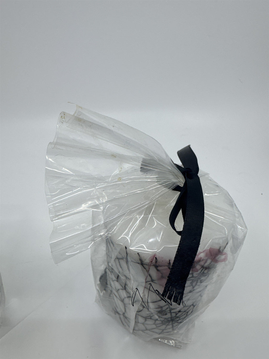 Set of Two White And Black Halloween Spider Web Candles In Plastic