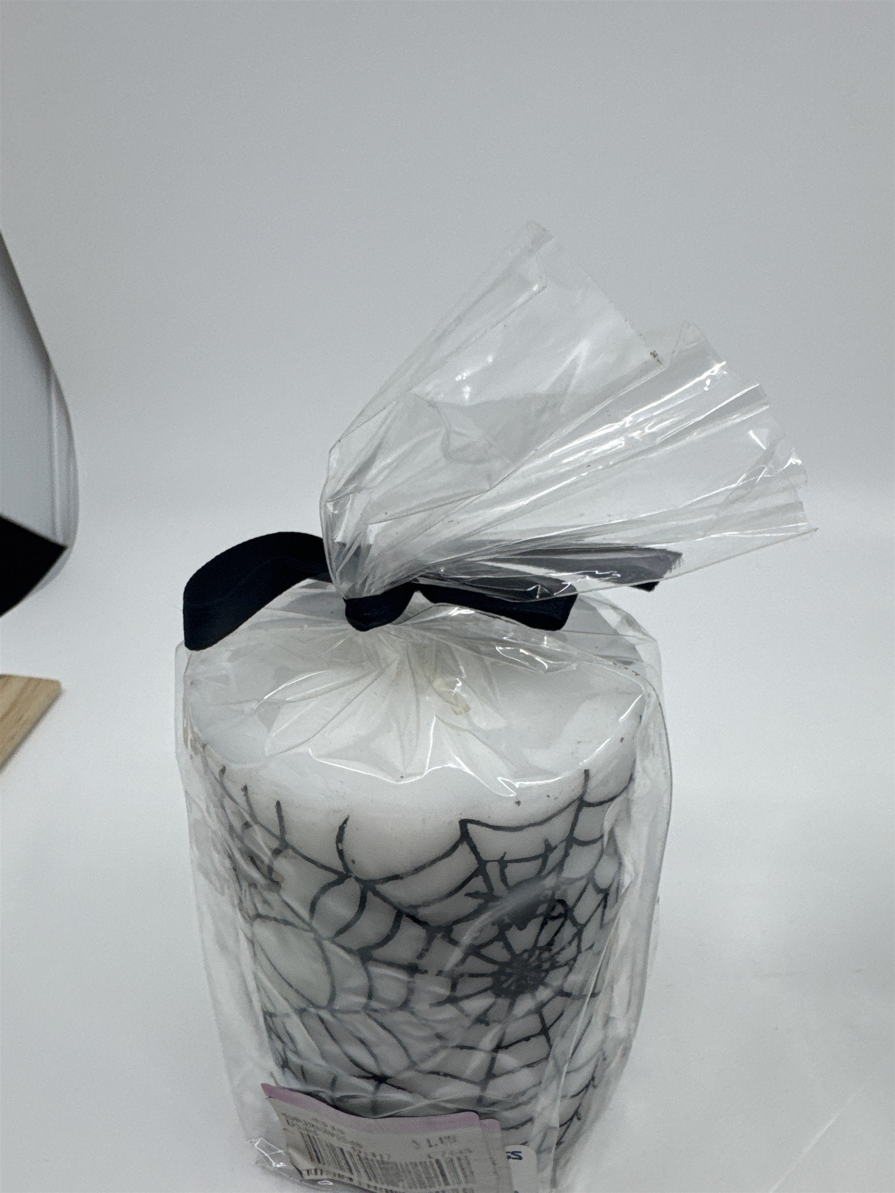 Set of Two White And Black Halloween Spider Web Candles In Plastic