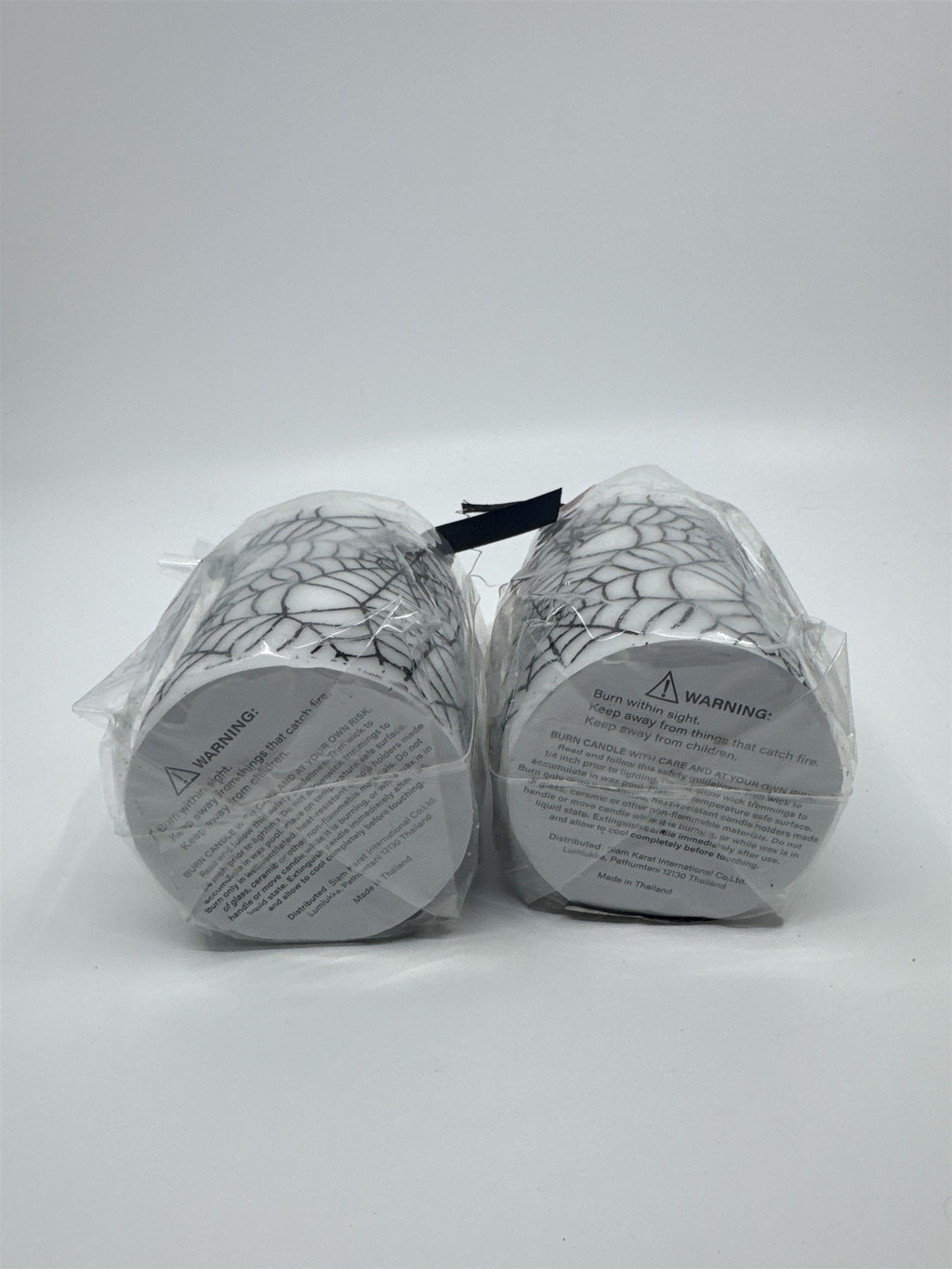 Set of Two White And Black Halloween Spider Web Candles In Plastic