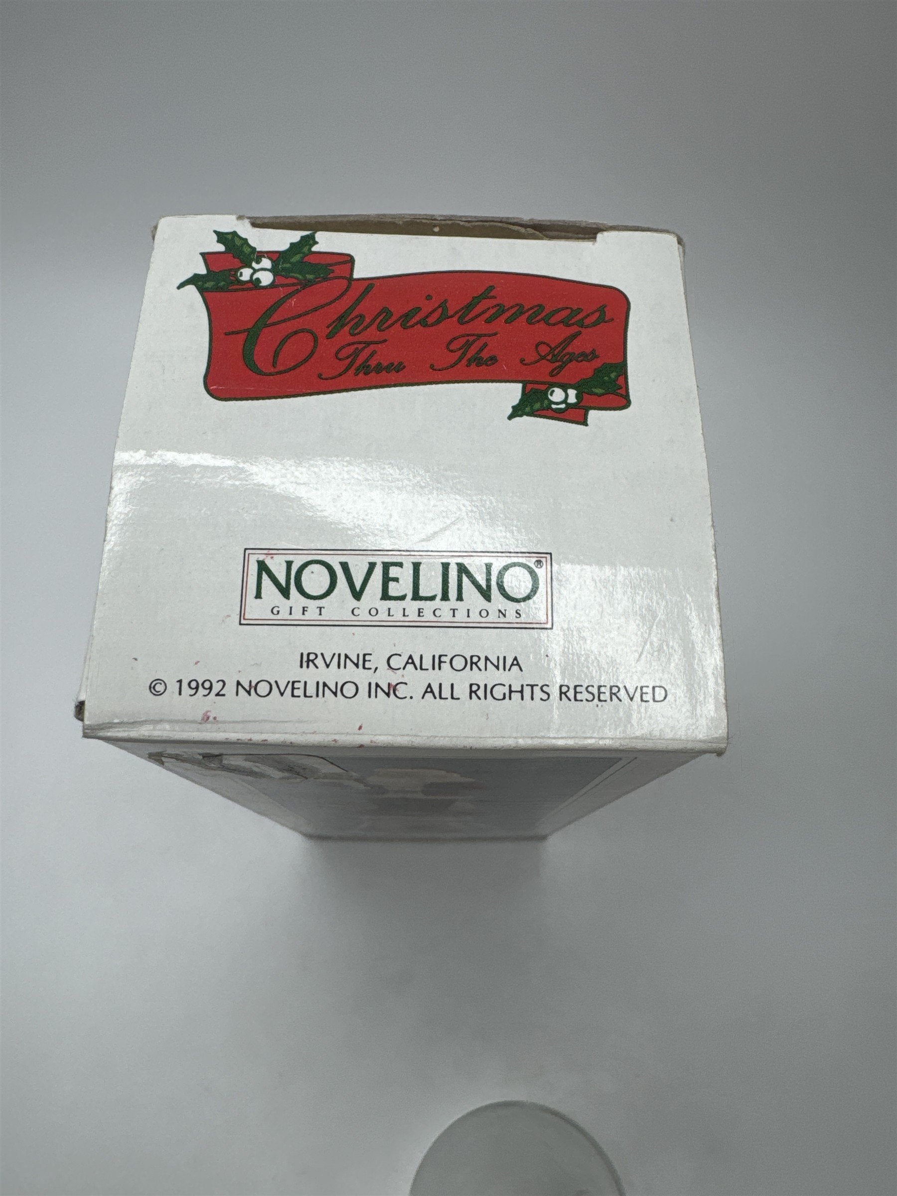 Vintage 1992 Novelino Christmas Through the Ages Modern Santa Bell