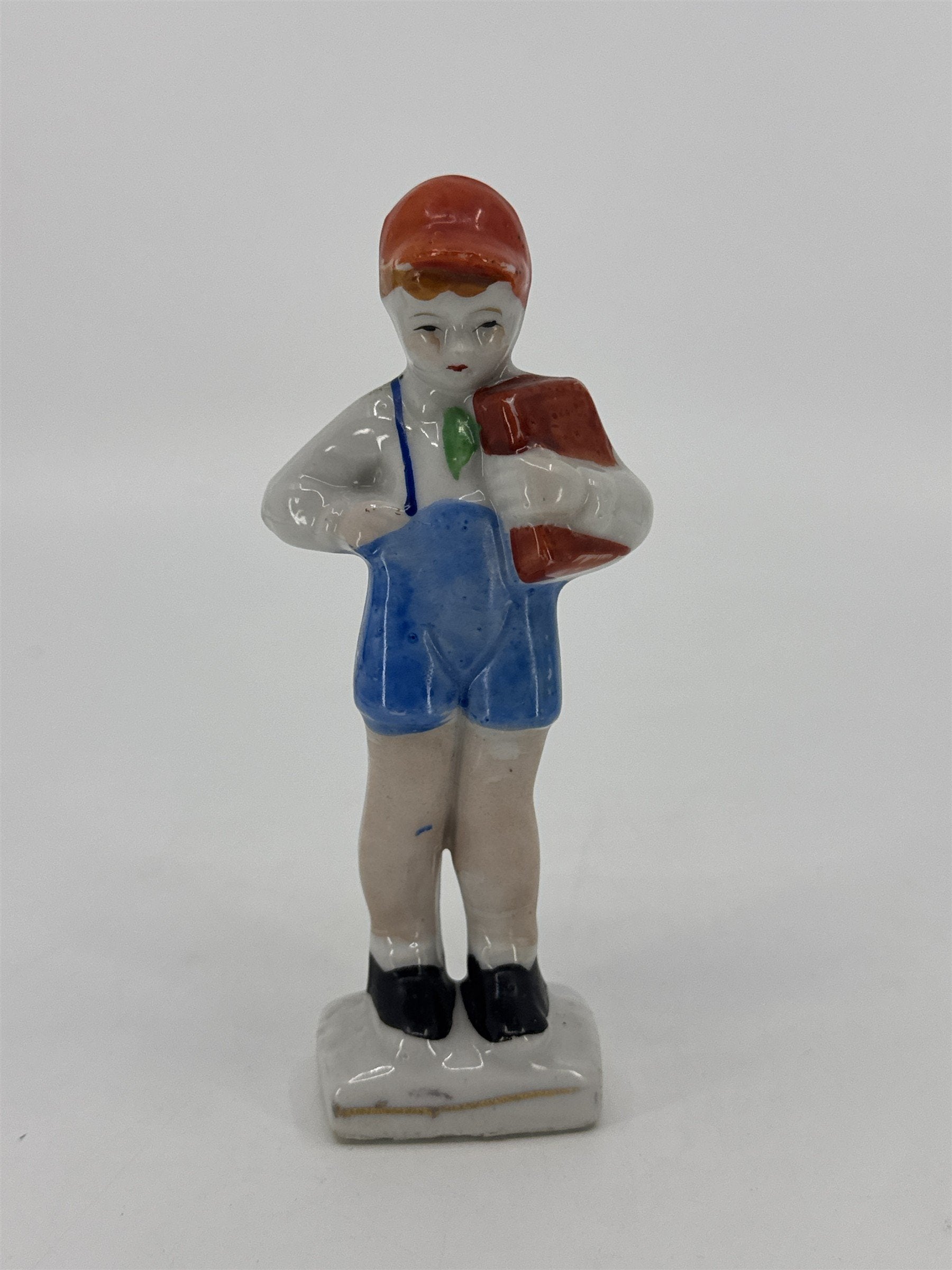 Vintage Porcelain Figurine Small Boy W/ Blue Trousers And A Brown Book Japan