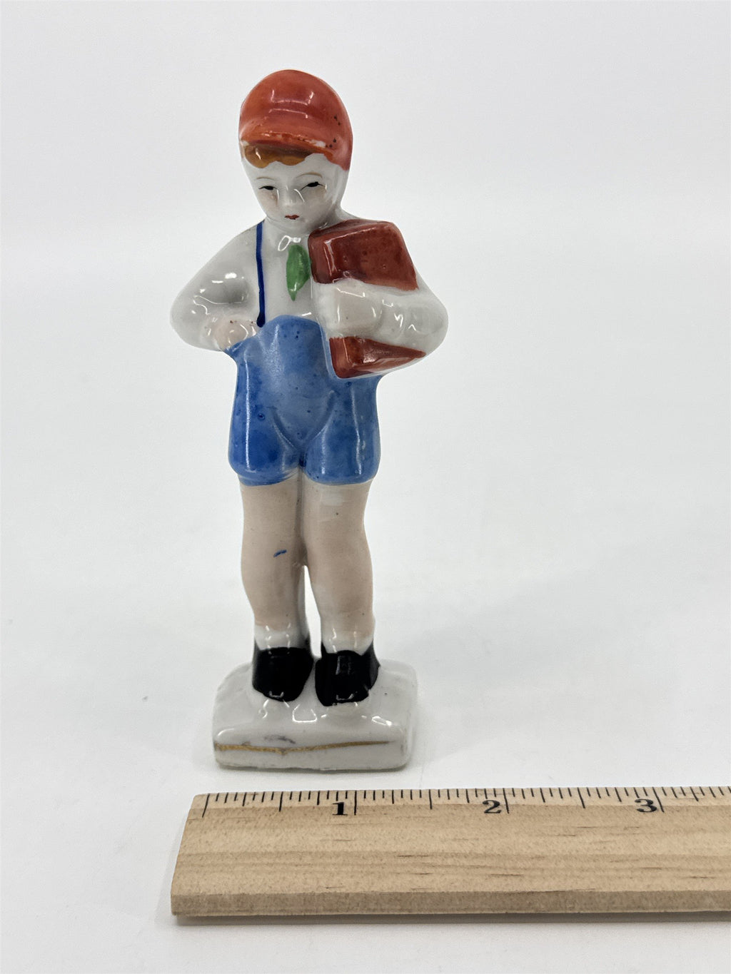 Vintage Porcelain Figurine Small Boy W/ Blue Trousers And A Brown Book Japan