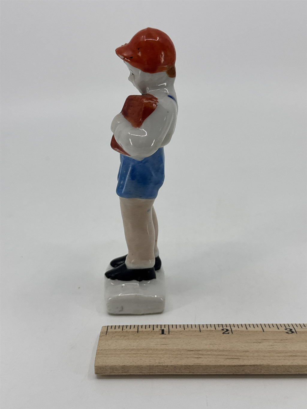 Vintage Porcelain Figurine Small Boy W/ Blue Trousers And A Brown Book Japan