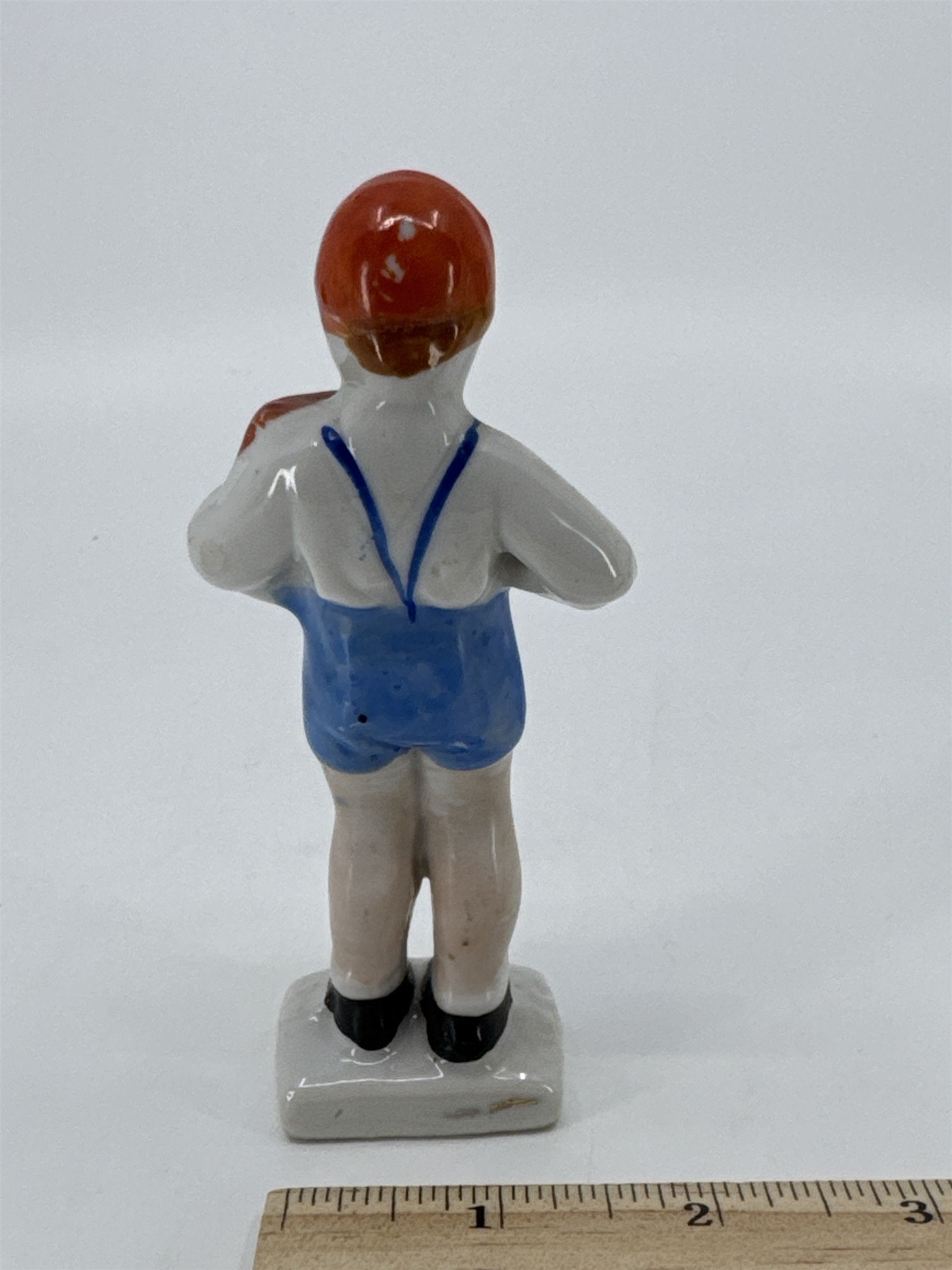 Vintage Porcelain Figurine Small Boy W/ Blue Trousers And A Brown Book Japan