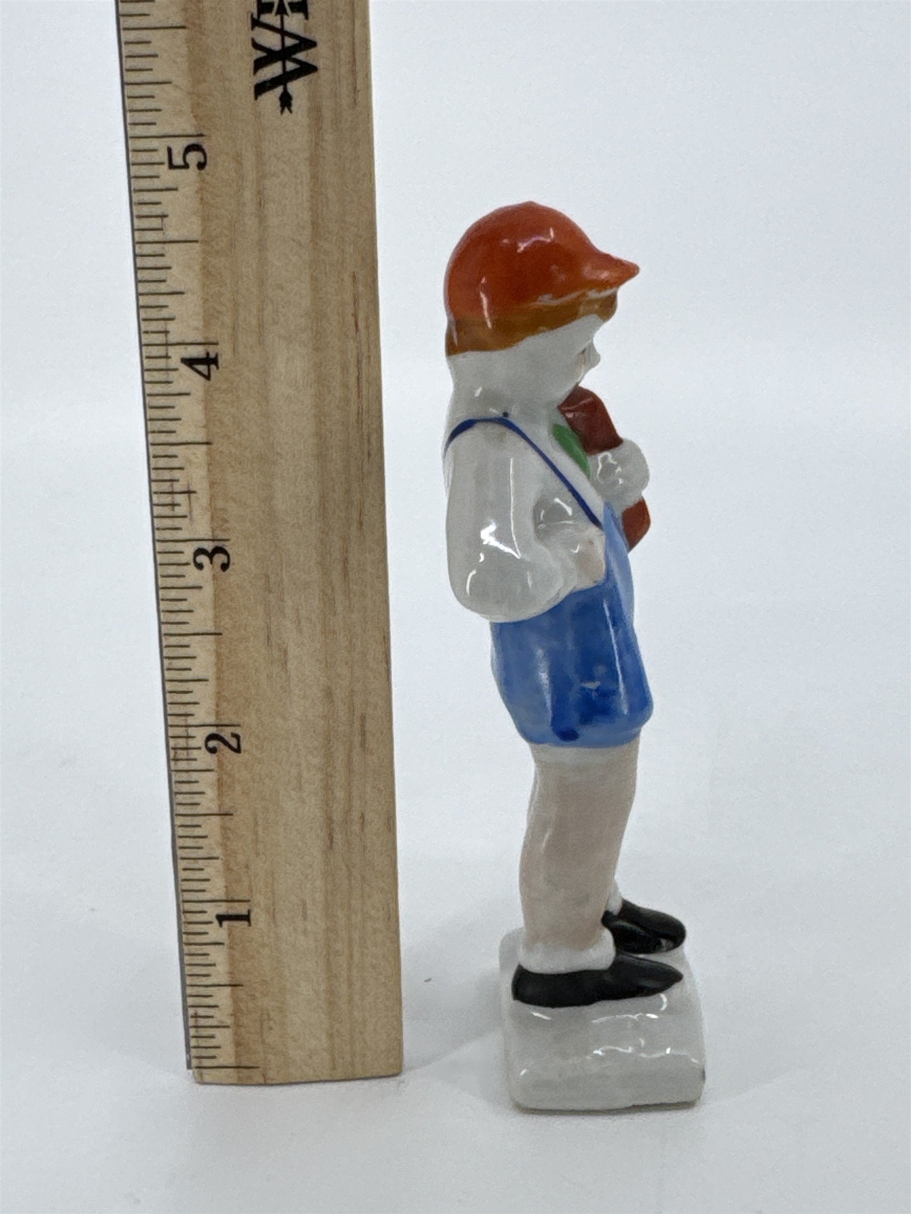 Vintage Porcelain Figurine Small Boy W/ Blue Trousers And A Brown Book Japan