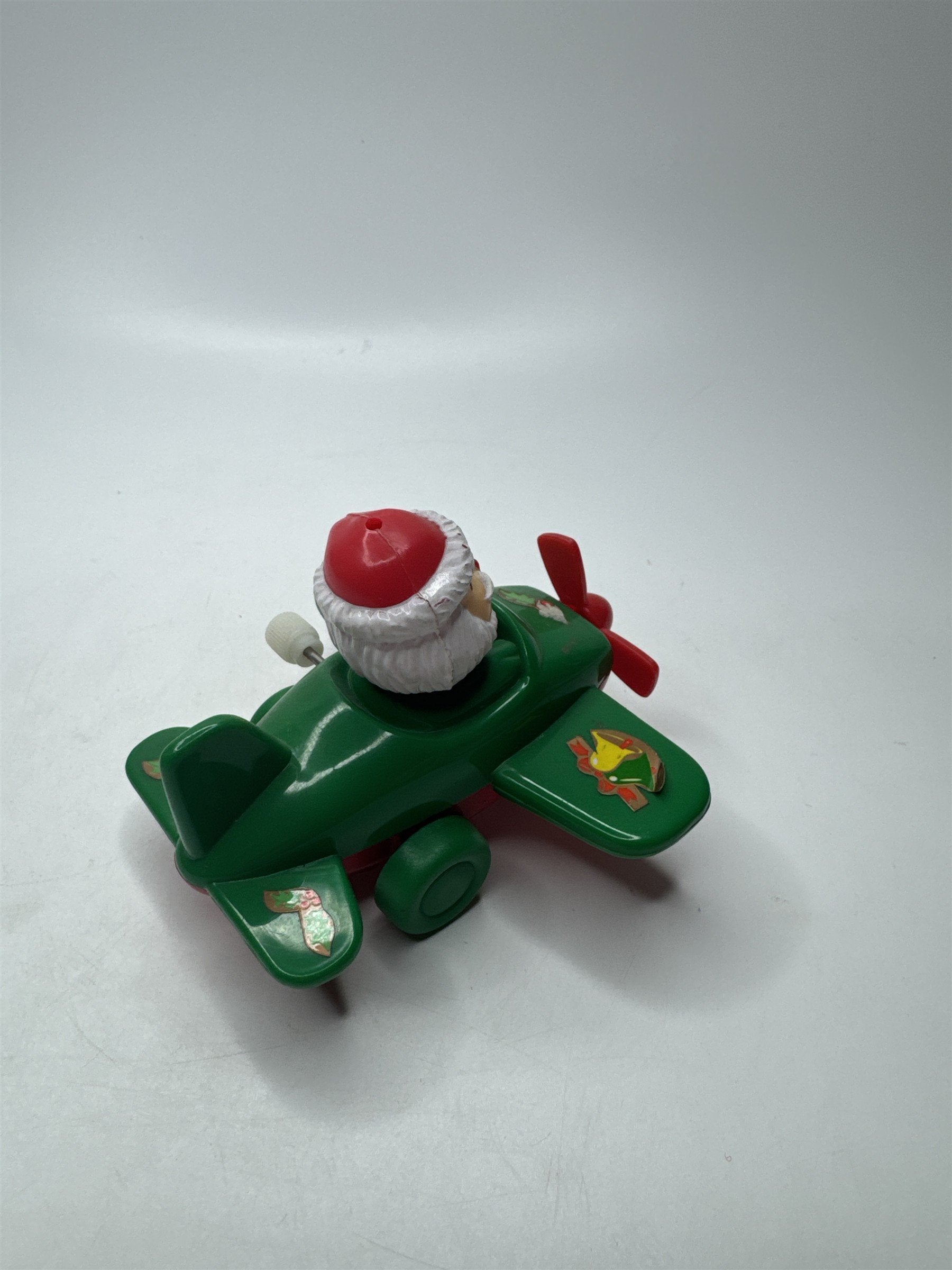 VTG Wind-Up Santa Claus Green Airplane Toy Hard Plastic Christmas Collectible