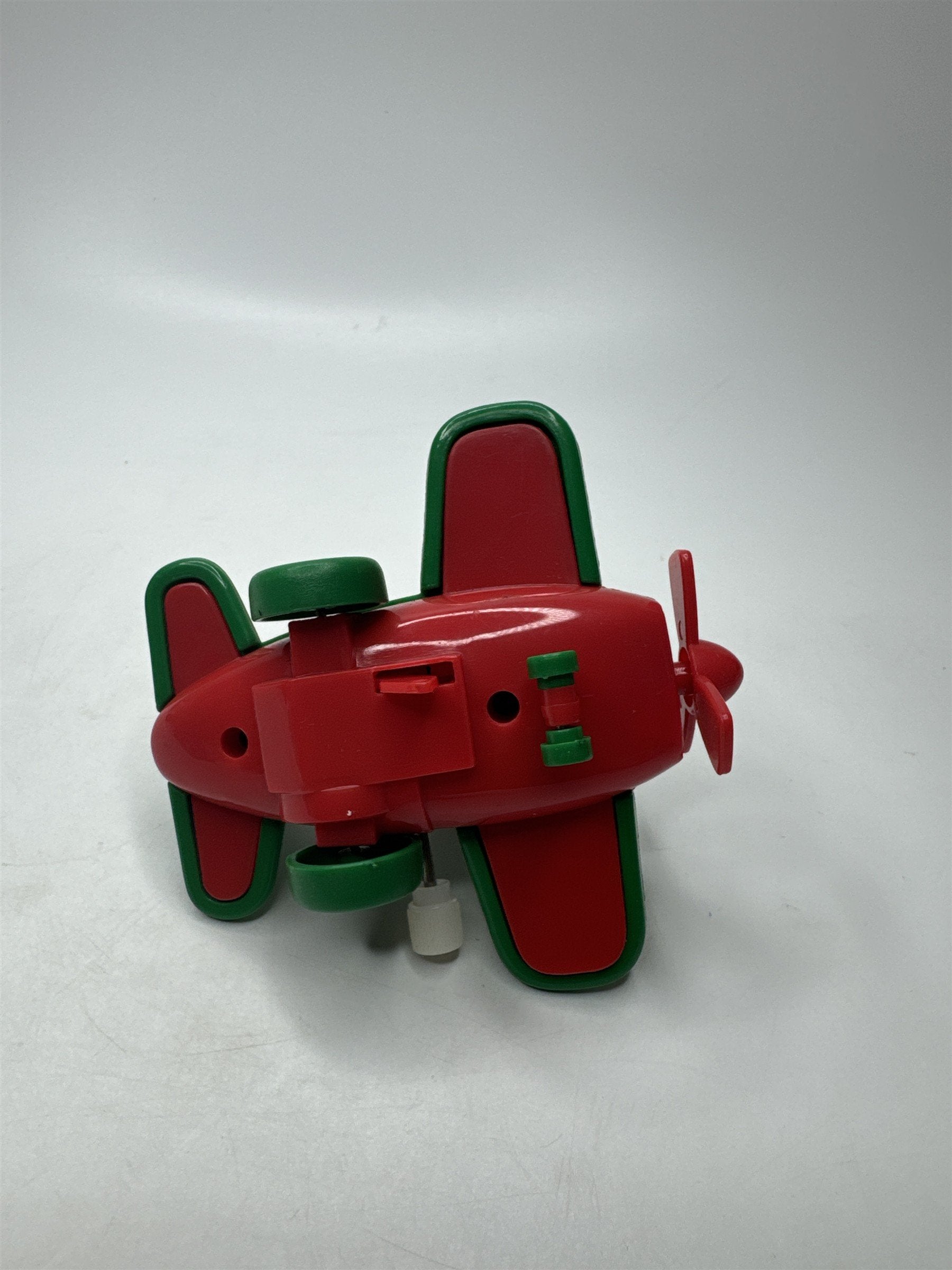 VTG Wind-Up Santa Claus Green Airplane Toy Hard Plastic Christmas Collectible