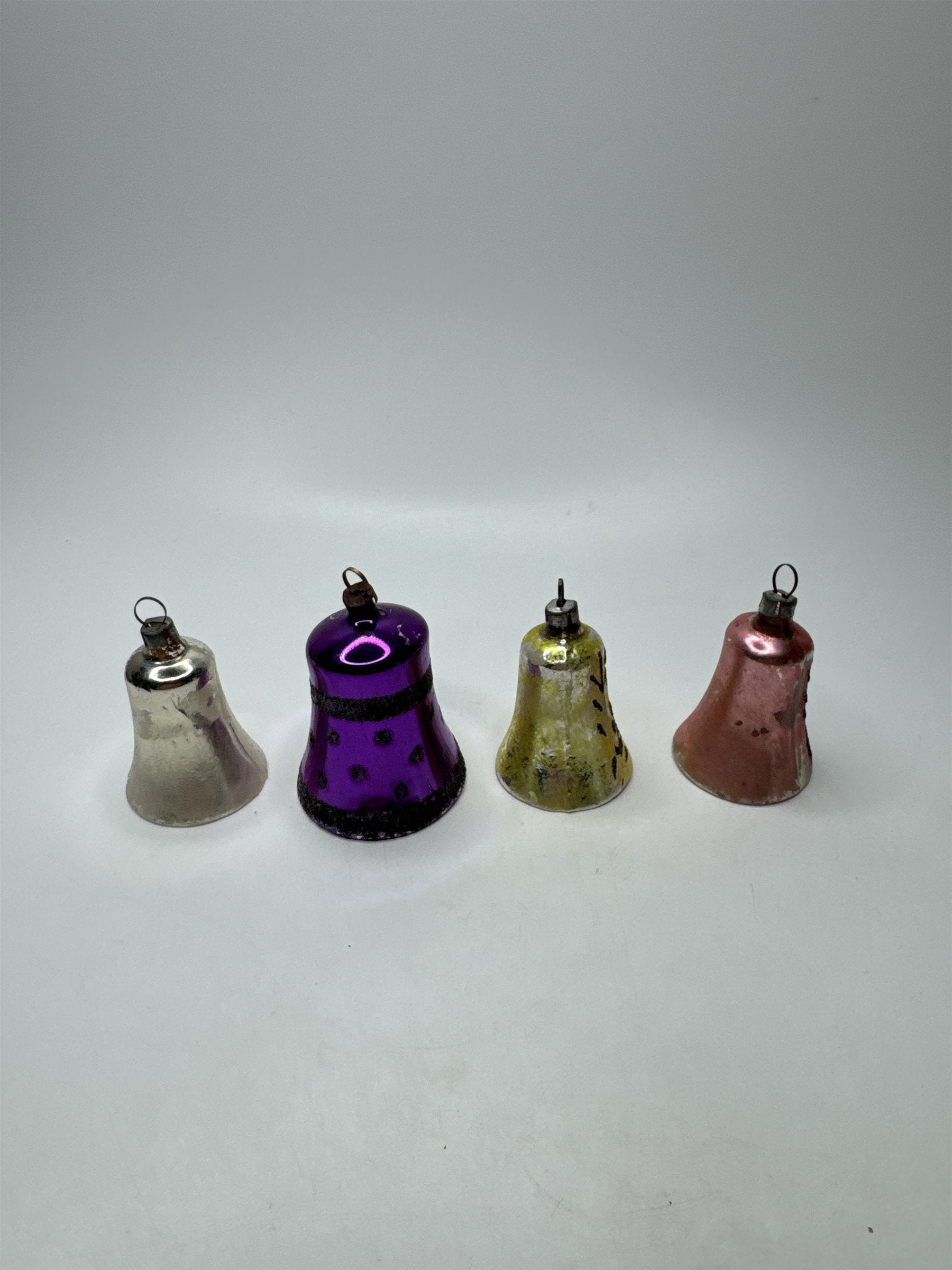 Set 4 Vintage Plastic Bell Ornaments Assorted Purple Scrollwork Glitter