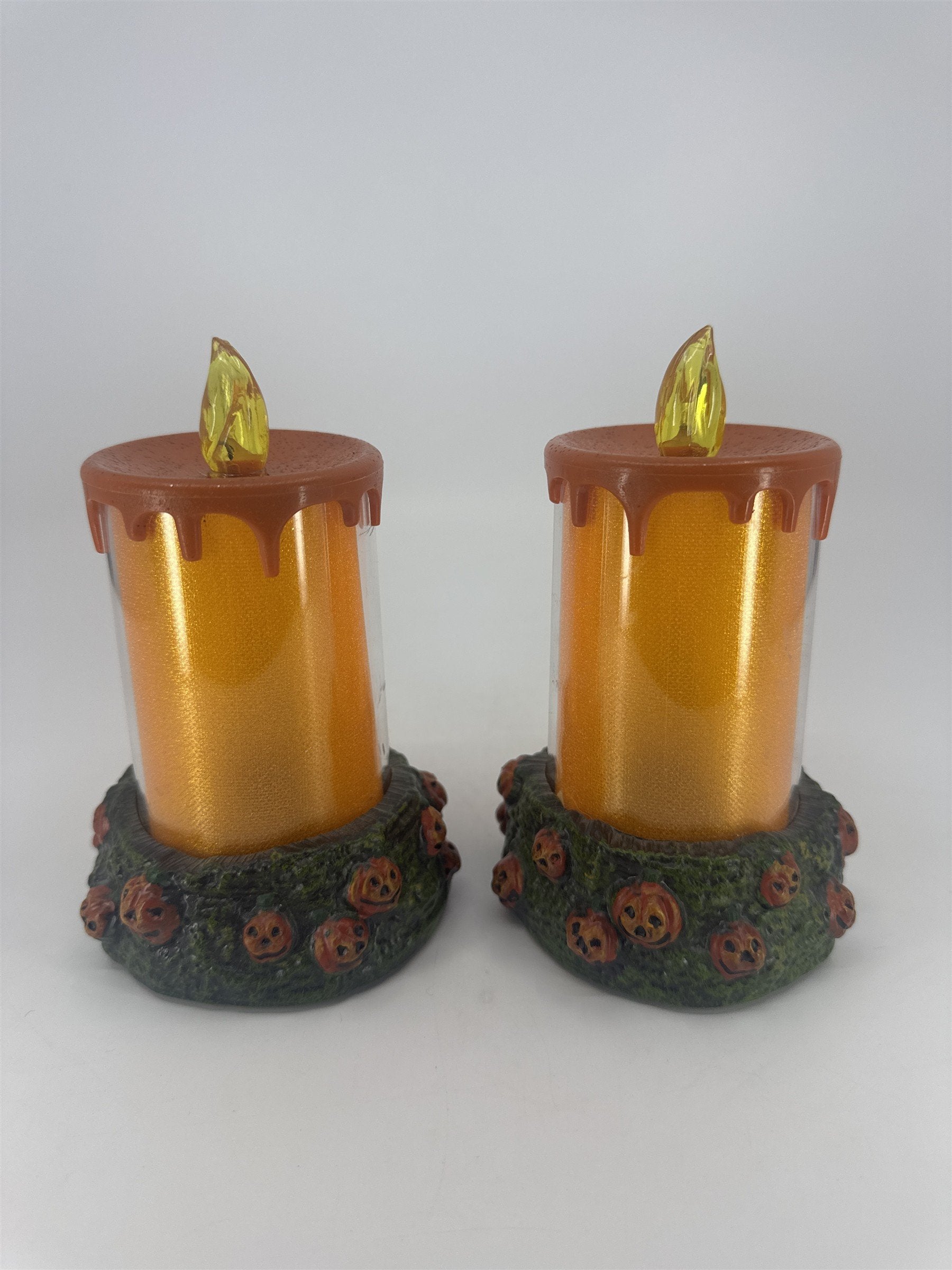 Set Of Two Vintage Halloween Melting Multicolor Light Up Candles W/ Pumpkin Base