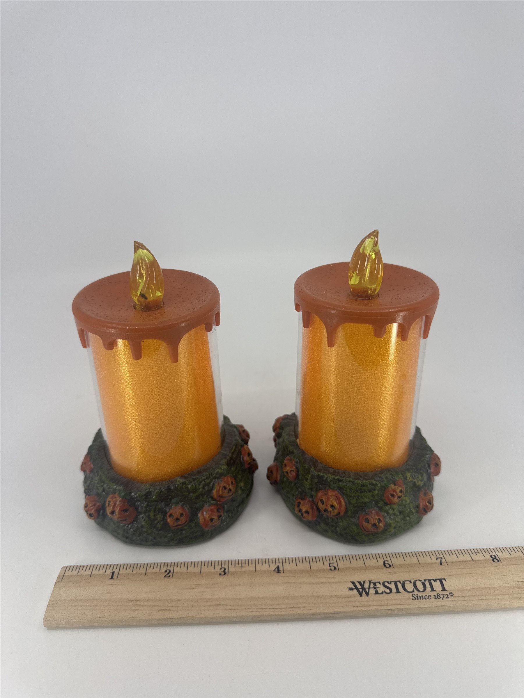 Set Of Two Vintage Halloween Melting Multicolor Light Up Candles W/ Pumpkin Base