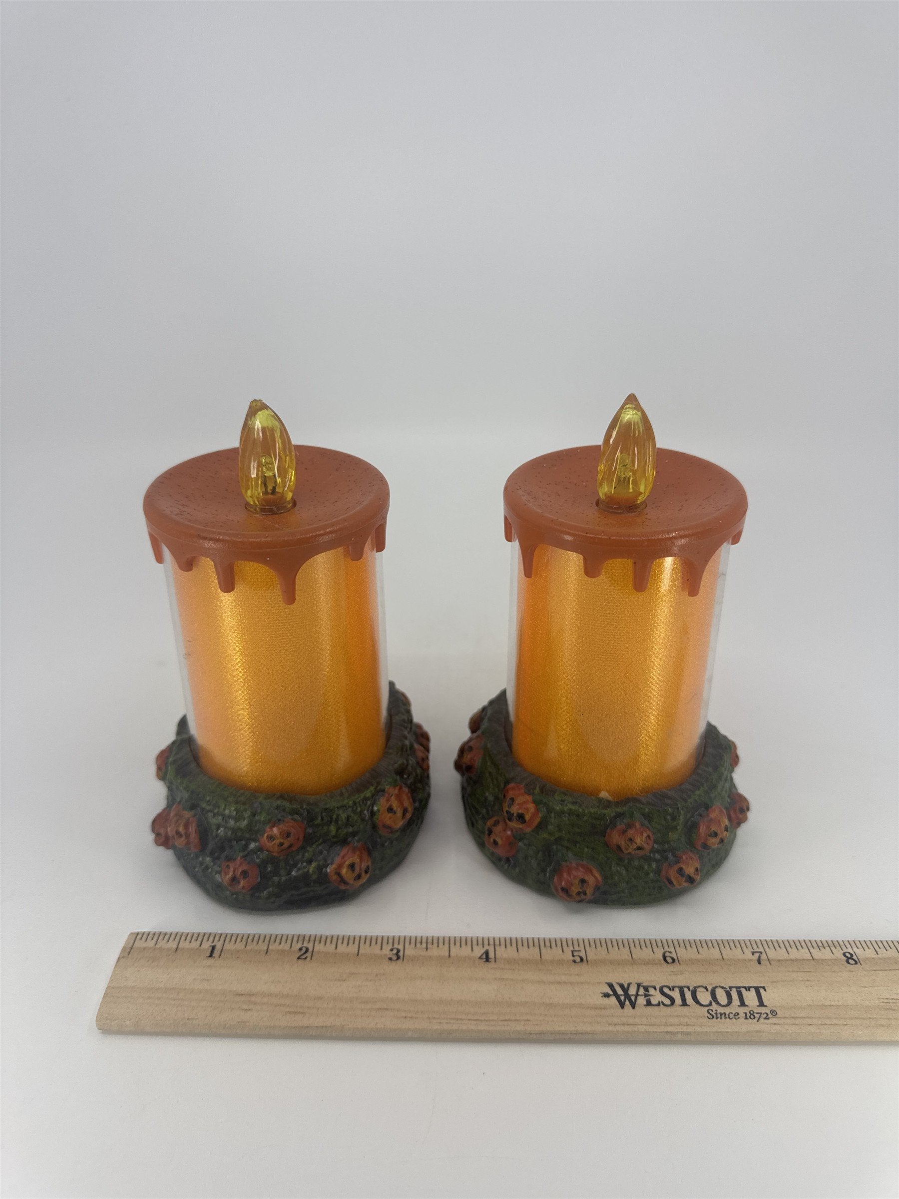 Set Of Two Vintage Halloween Melting Multicolor Light Up Candles W/ Pumpkin Base