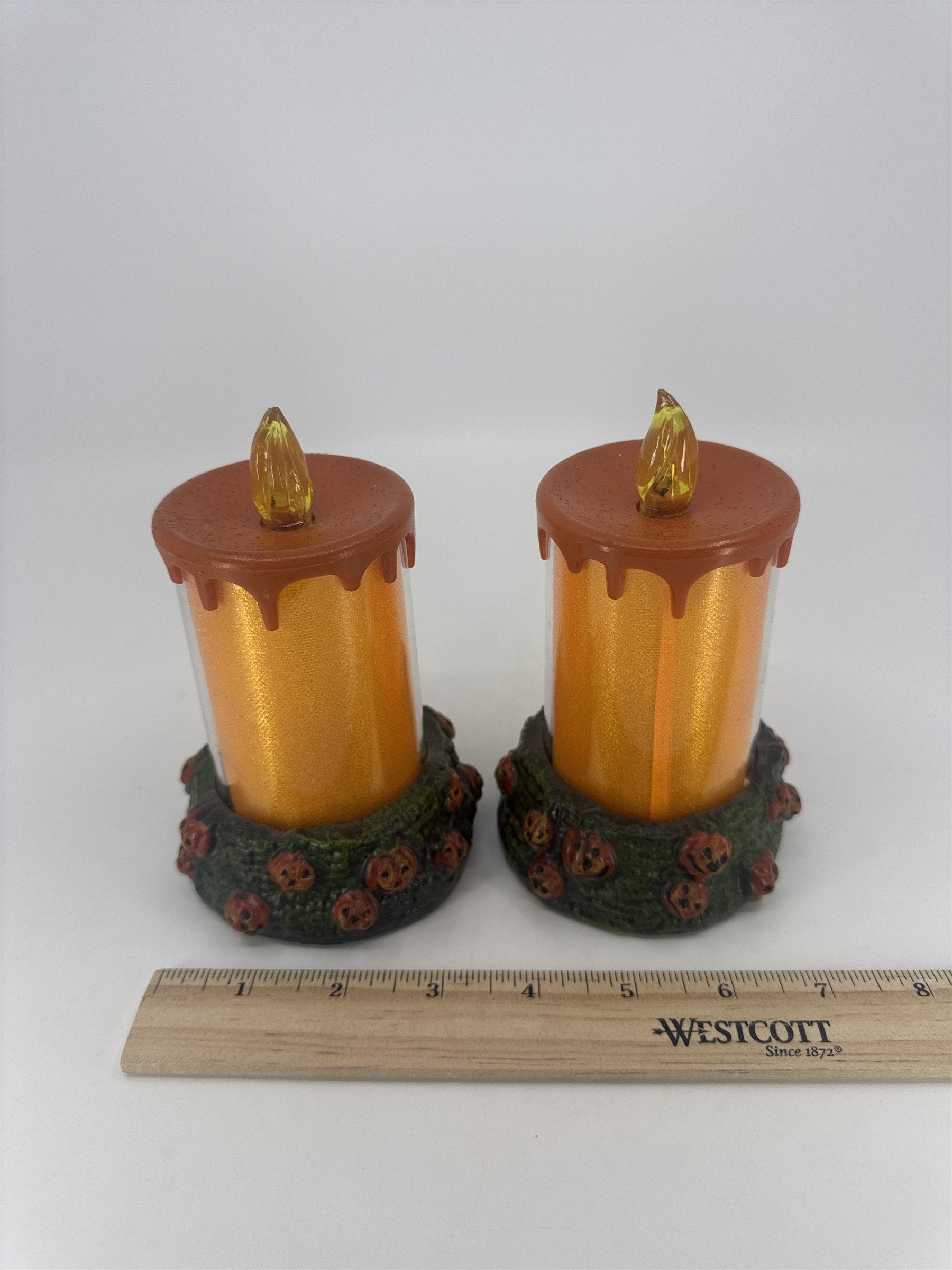Set Of Two Vintage Halloween Melting Multicolor Light Up Candles W/ Pumpkin Base