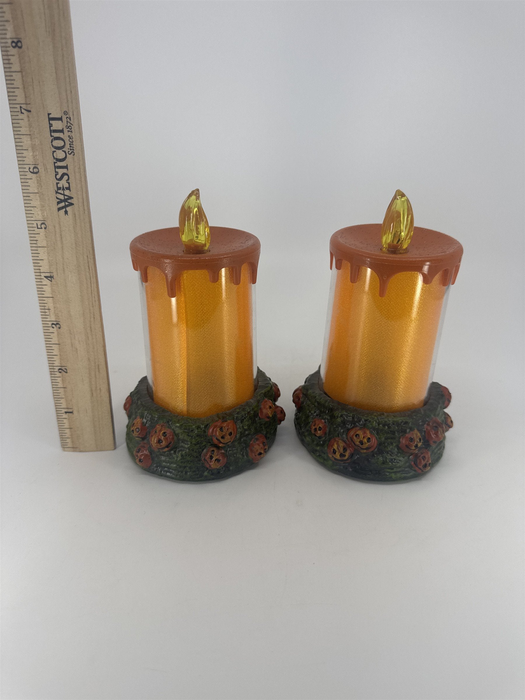 Set Of Two Vintage Halloween Melting Multicolor Light Up Candles W/ Pumpkin Base