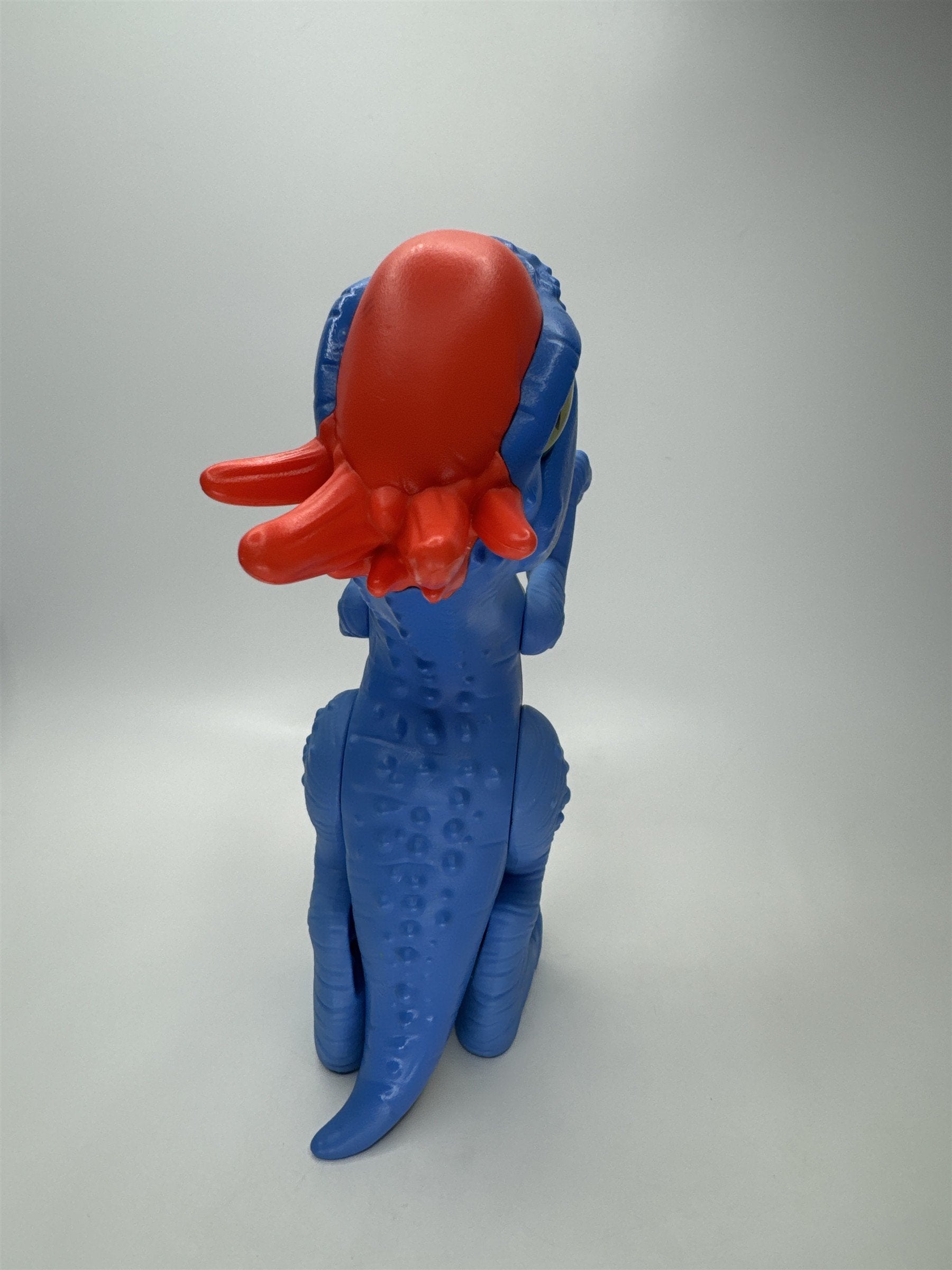 Stylized Blue Dinosaur Figure Toy Red Head Green Eye PVC Imaginext Style